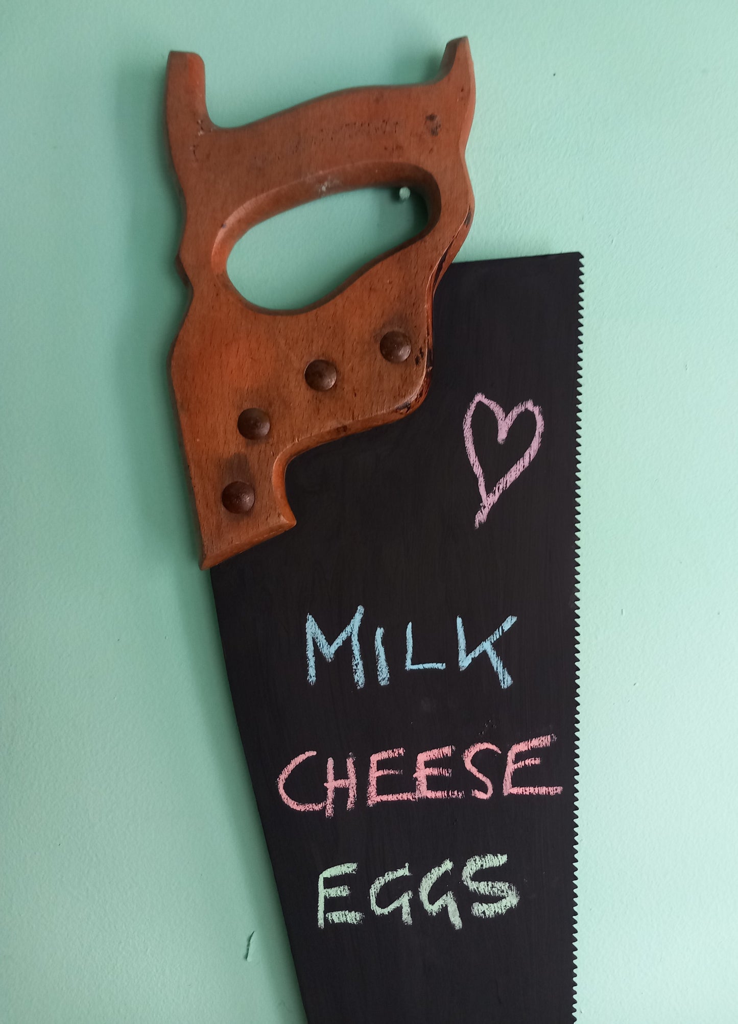 Vintage wooden handled saw wall mounted chalkboard