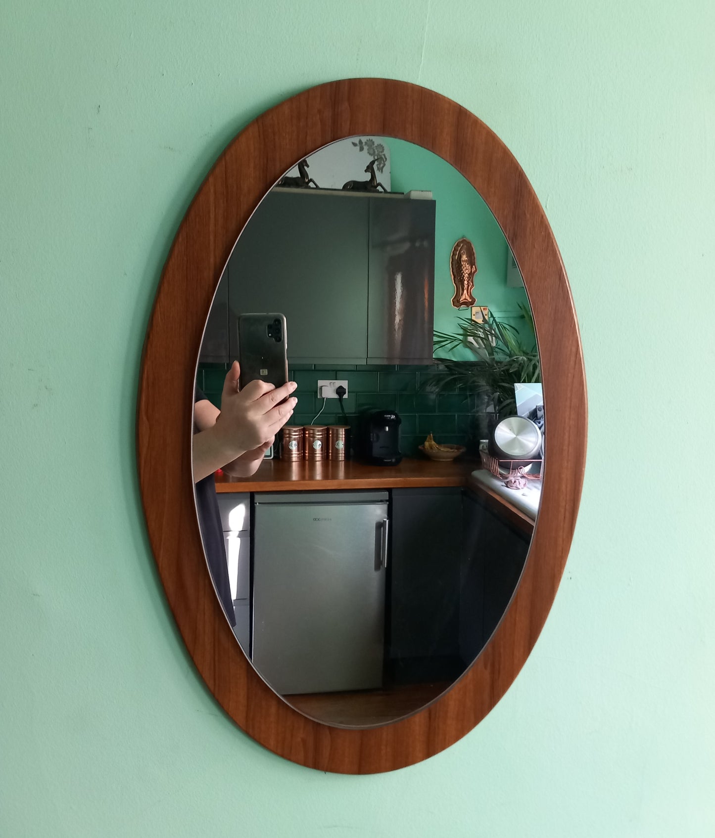 Mid century 1970s teak wood effect backed oval wall mirror 23"