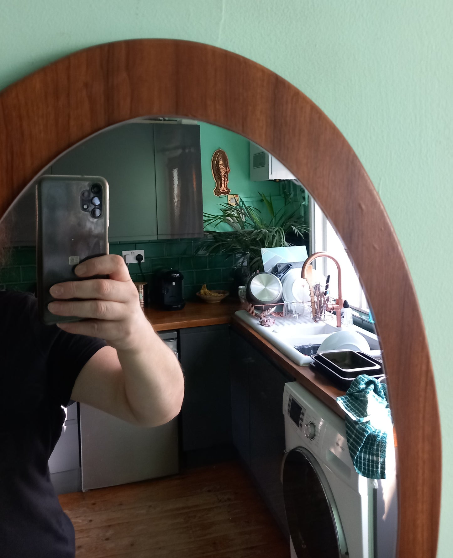 Mid century 1970s teak wood effect backed oval wall mirror 23"