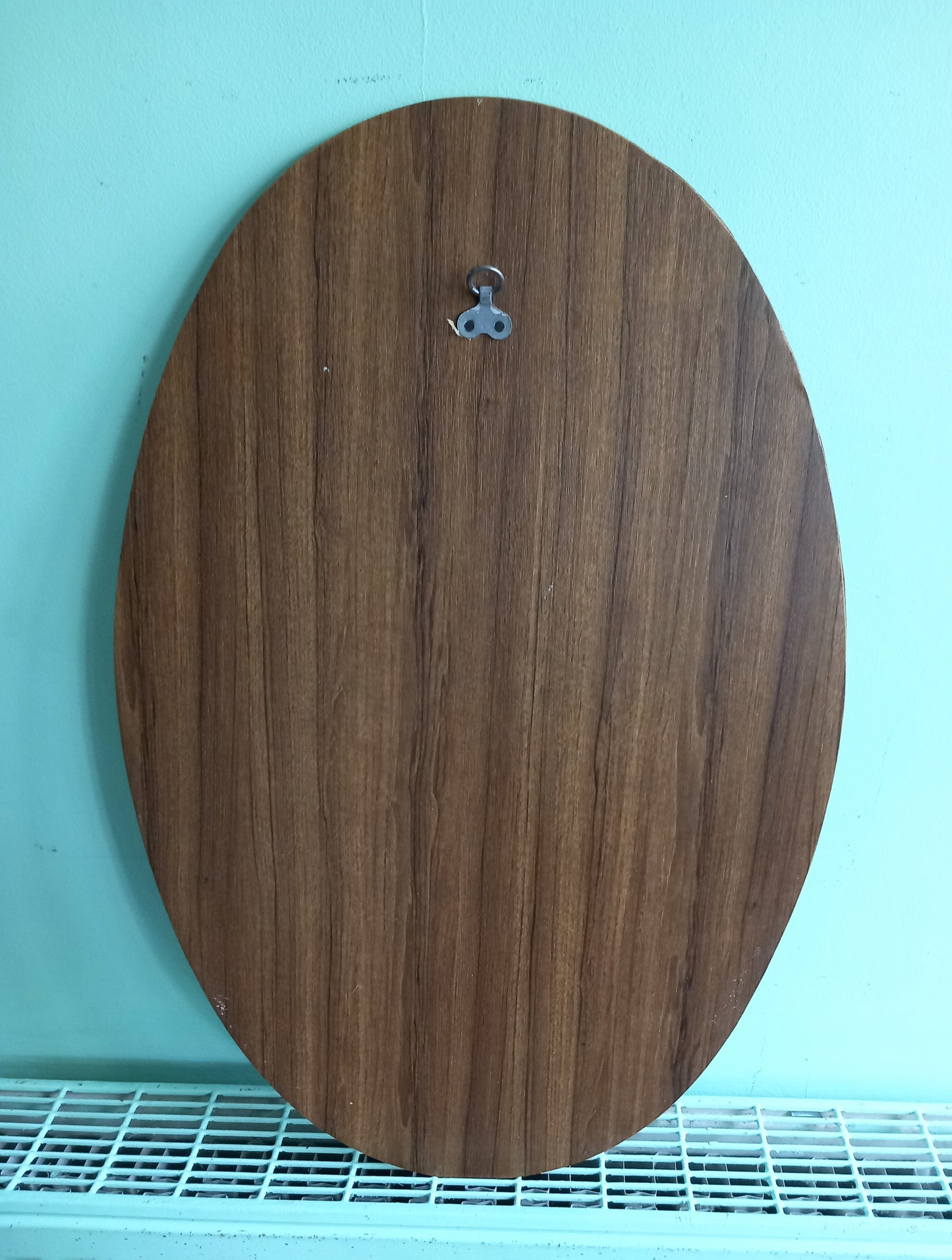 Mid century 1970s teak wood effect backed oval wall mirror 23"