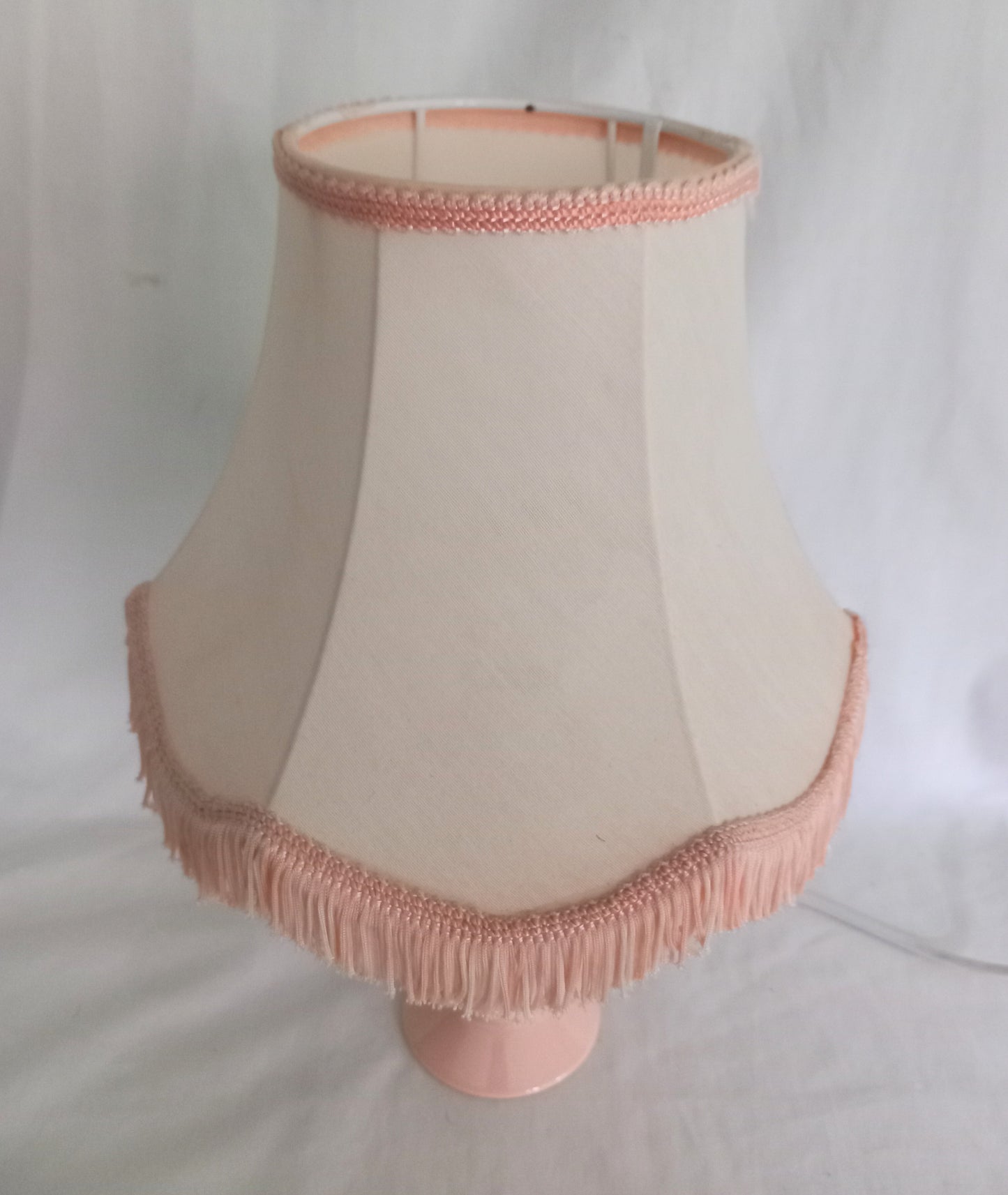 1980s peach orange table lamp with matching fringed shade