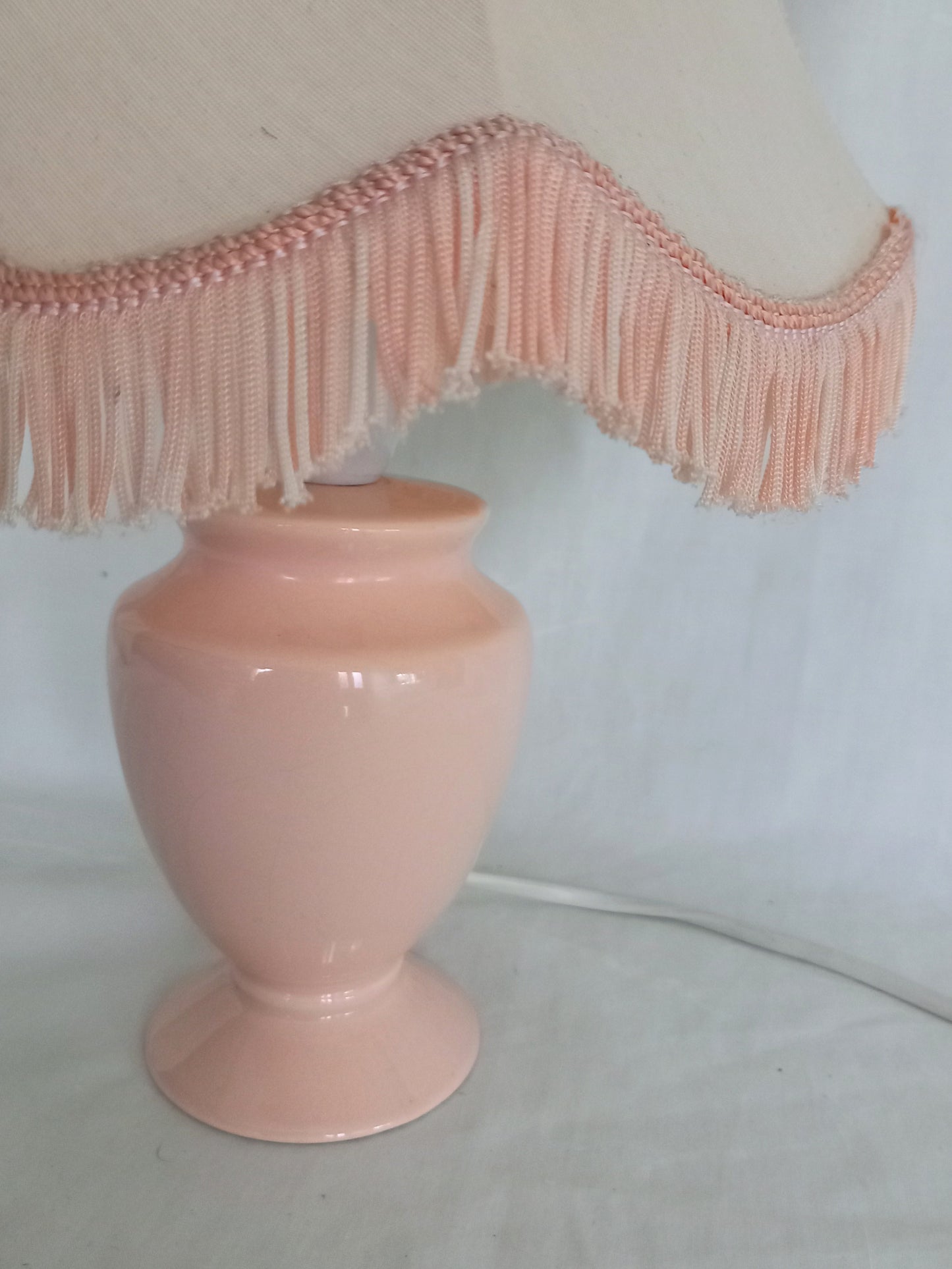 1980s peach orange table lamp with matching fringed shade