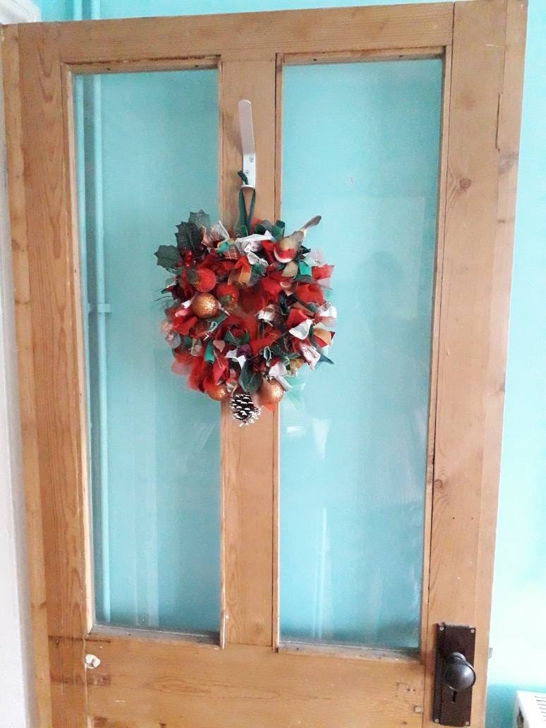 Hand made winter red, green & gold rag wreath with robin, holly and baubles