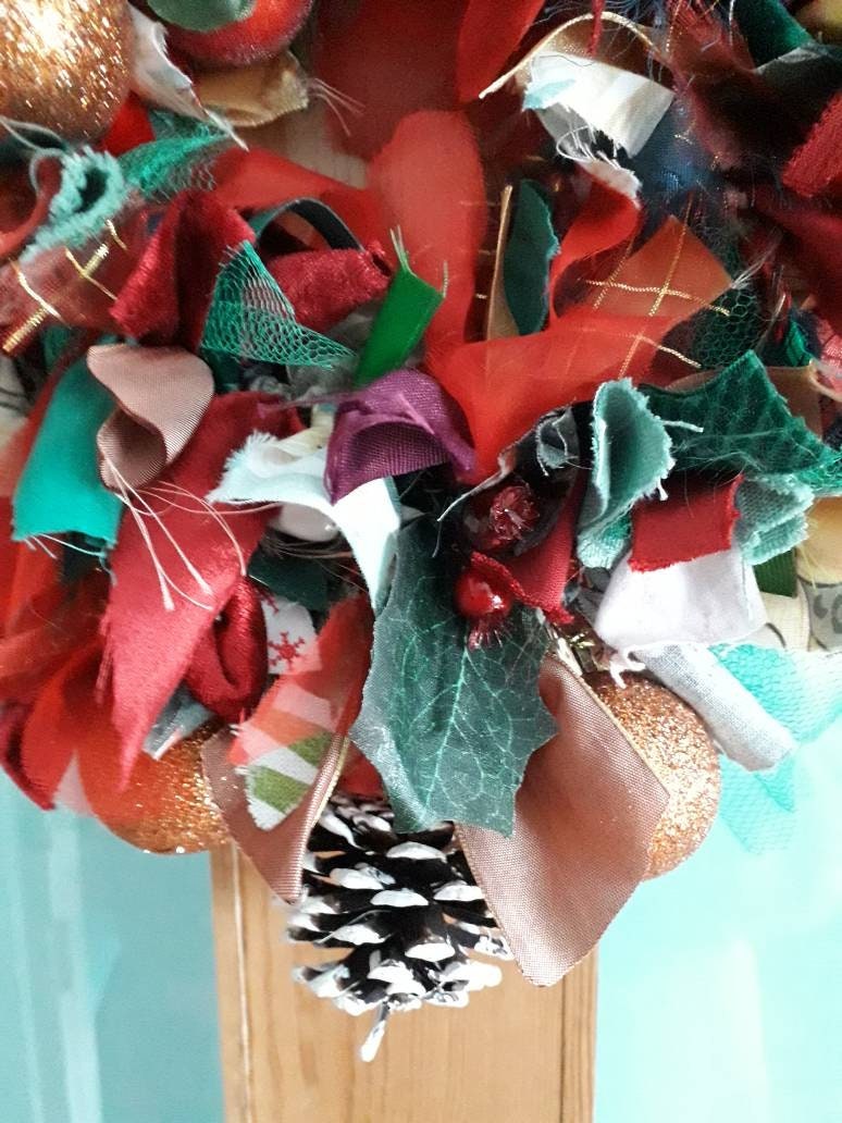 Hand made winter red, green & gold rag wreath with robin, holly and baubles