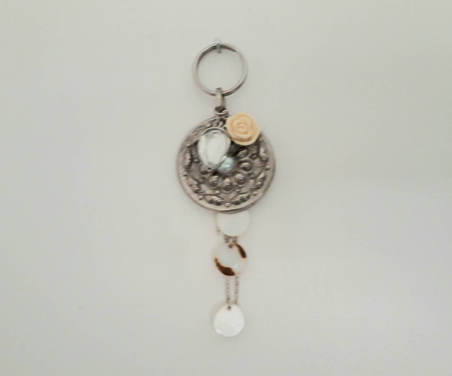 Hand made bag charm keyring silvertone flower disc, acrylic rose and mother of pearl tassel