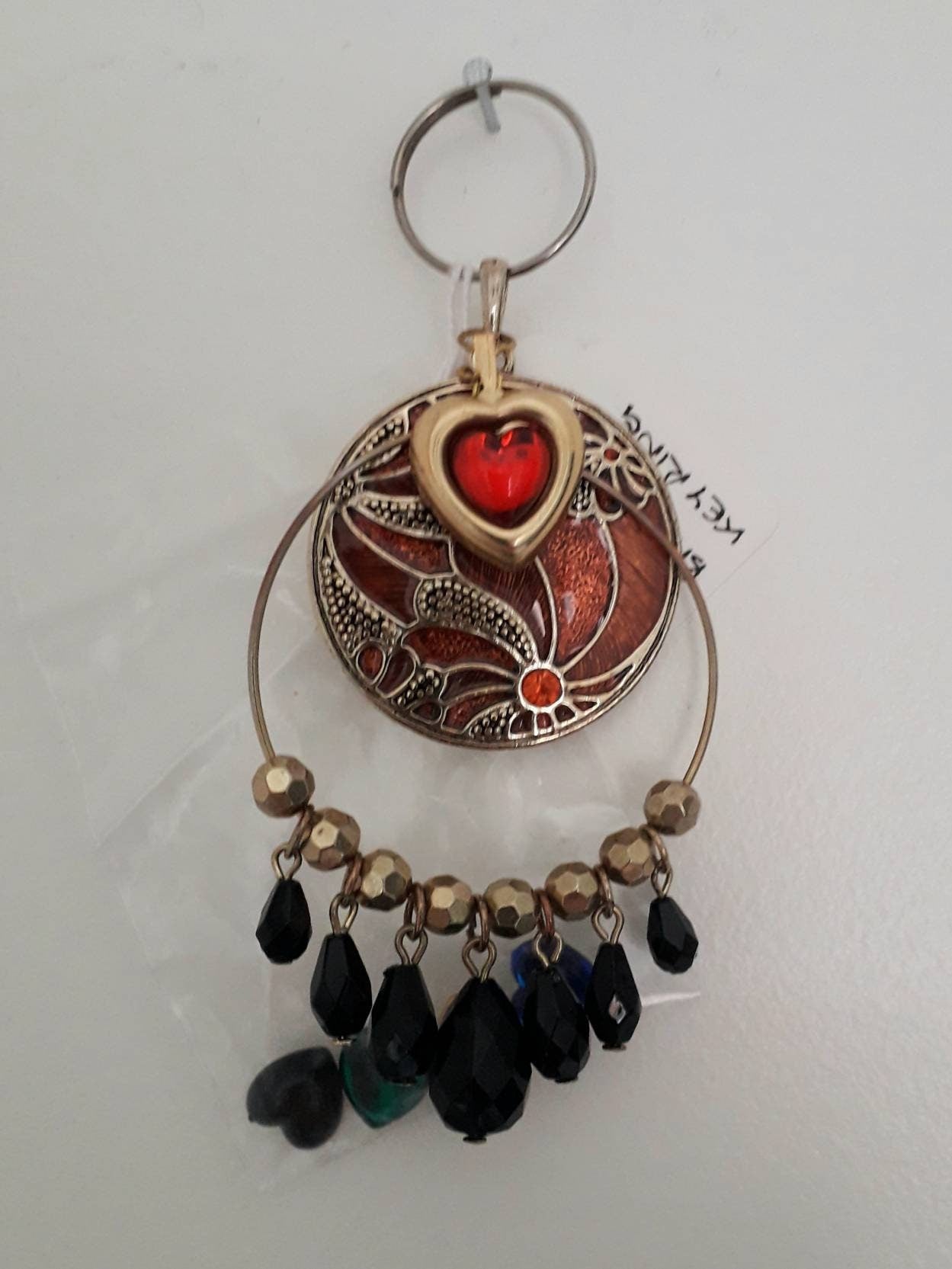 hand made purse charm keyring with brown cloisonne enamelled flower disc, bead tassels and colour change heart charm