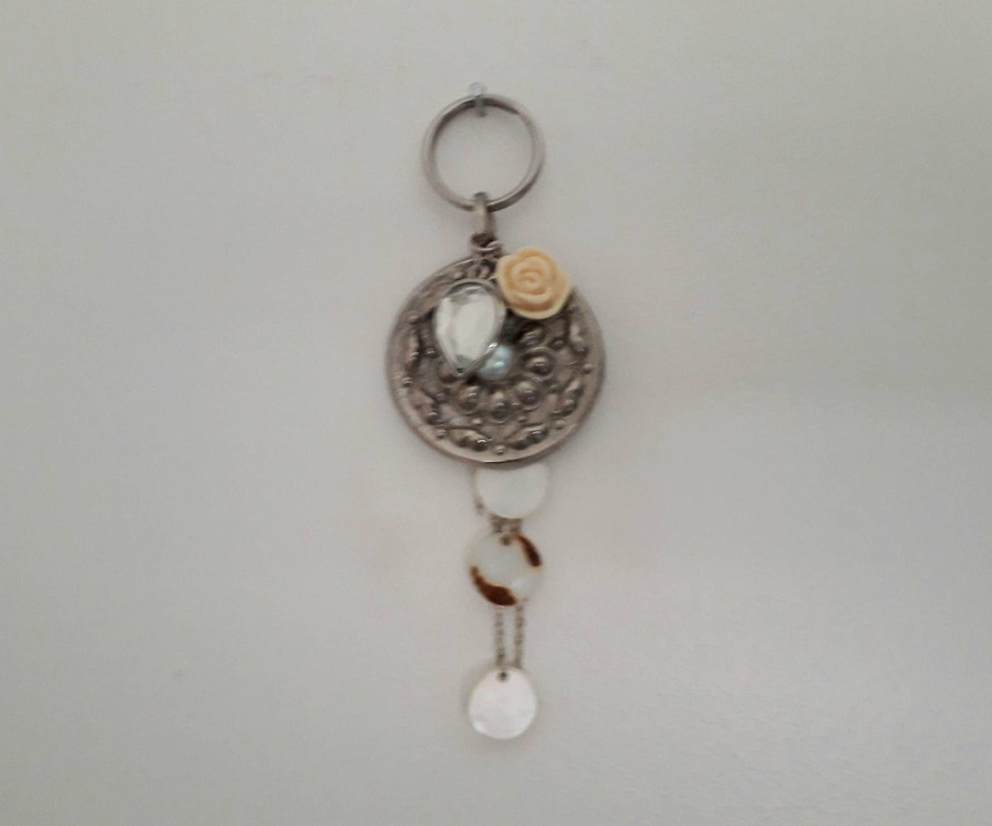 Hand made bag charm keyring silvertone flower disc, acrylic rose and mother of pearl tassel