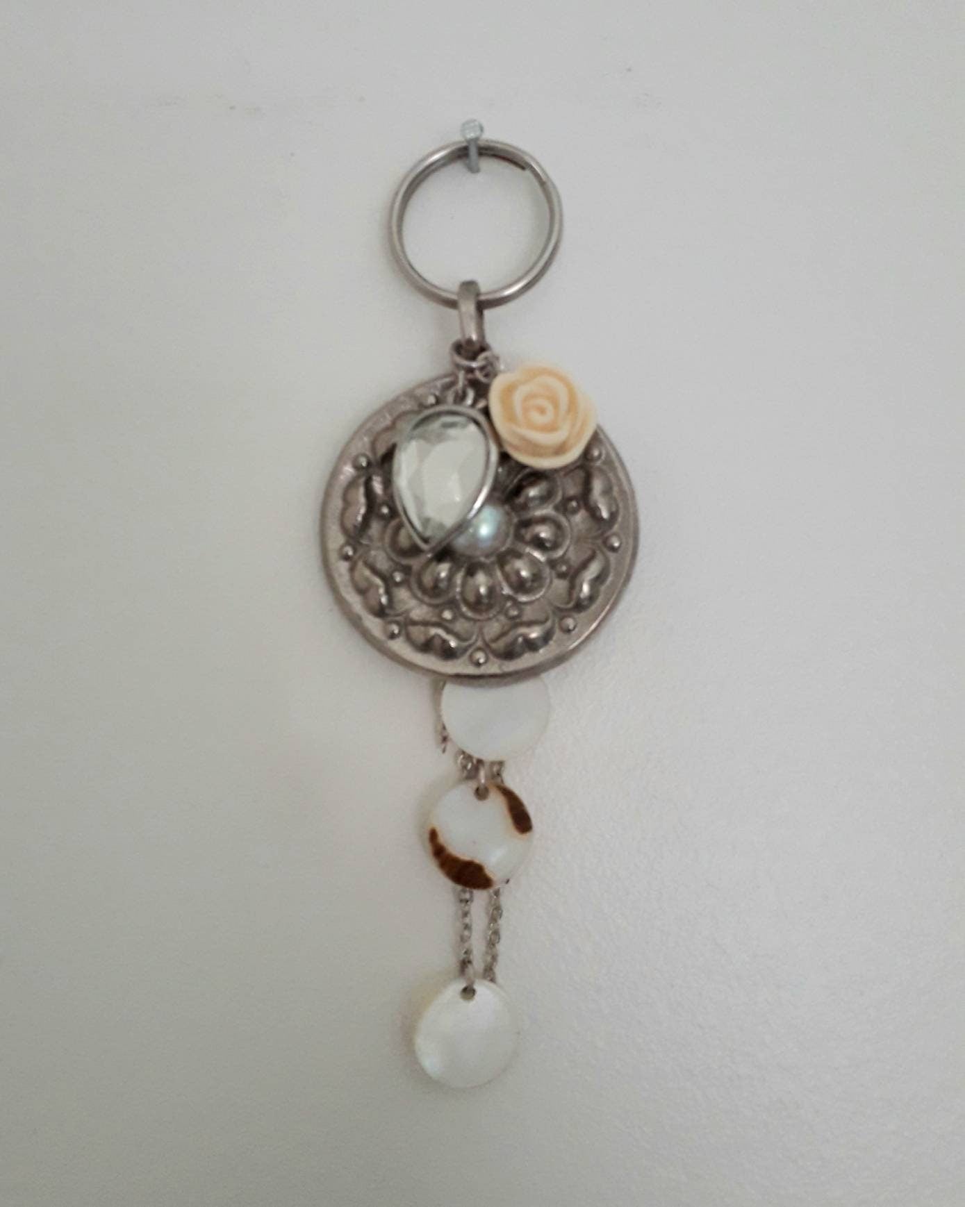 Hand made bag charm keyring silvertone flower disc, acrylic rose and mother of pearl tassel