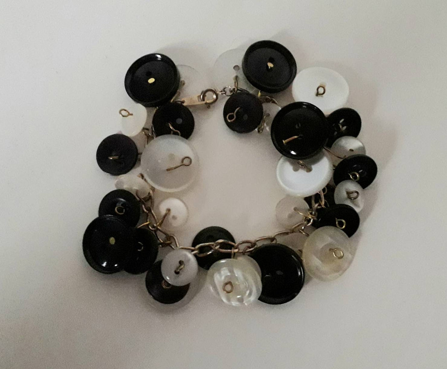 Hand made goldtone and monochrome vintage button charm bracelet