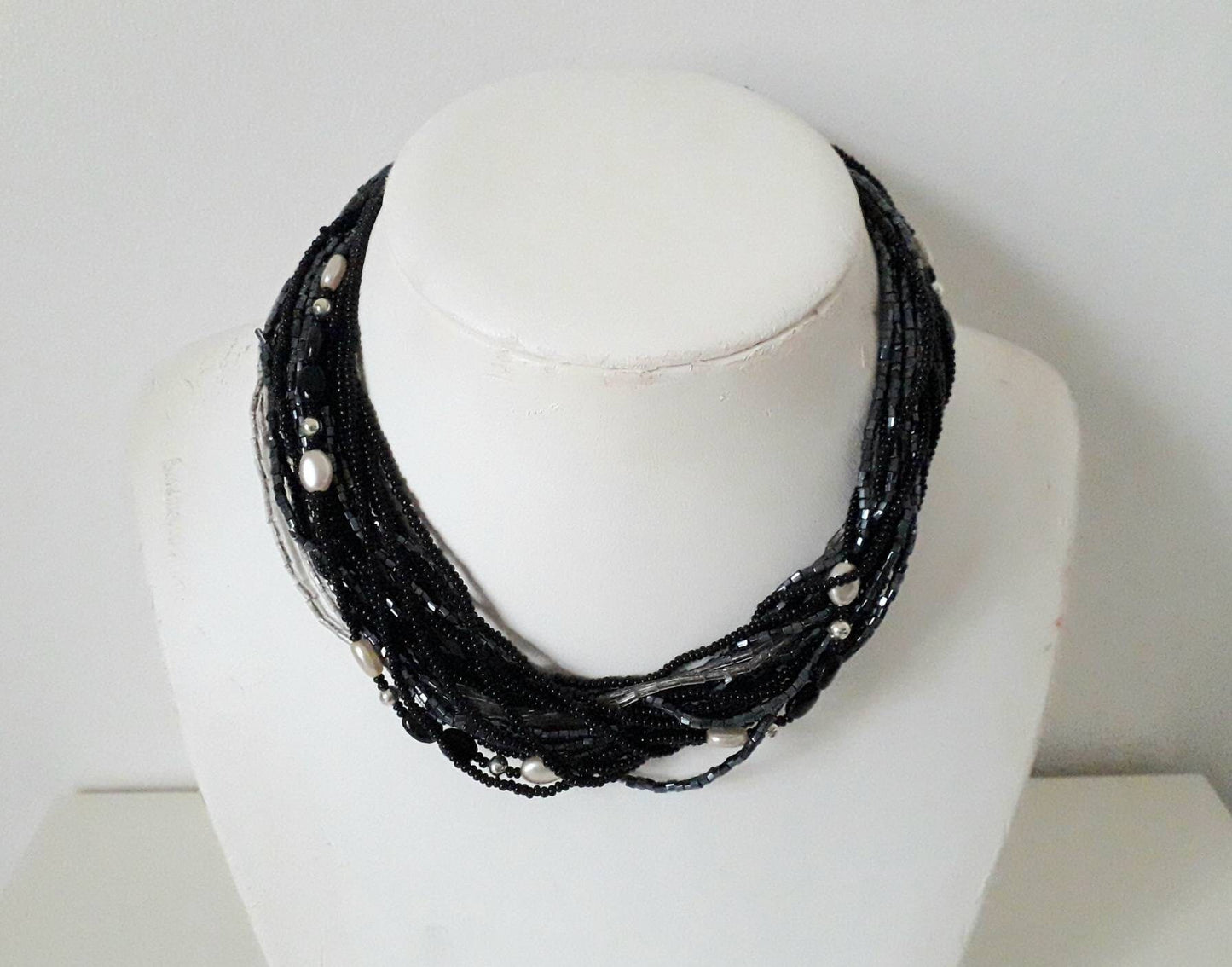 1960s black, clear and pewter coloured multi stranded glass bead necklace