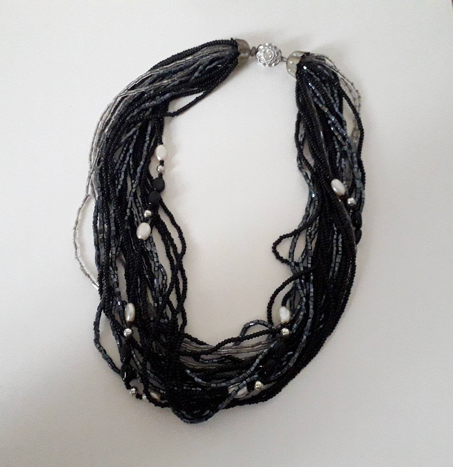 1960s black, clear and pewter coloured multi stranded glass bead necklace