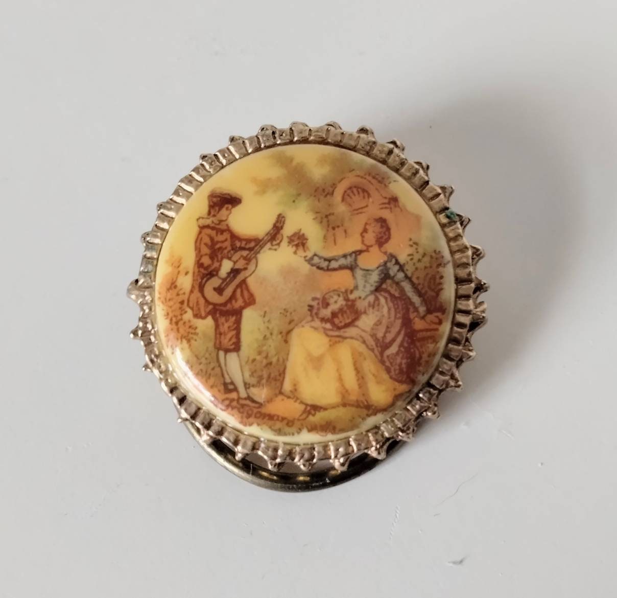 1960s goldtone and ceramic porcelain transfer printed Regency couple scene scarf clip