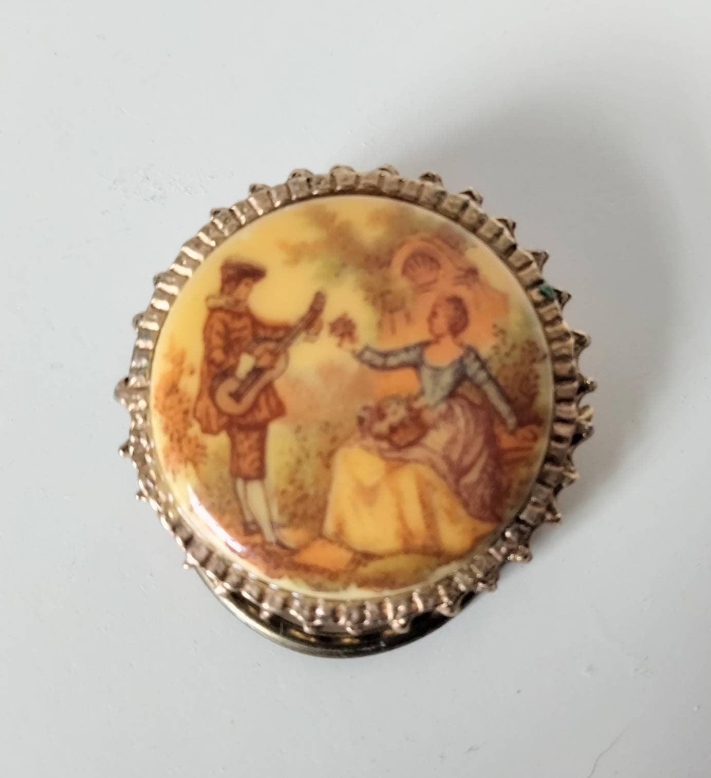 1960s goldtone and ceramic porcelain transfer printed Regency couple scene scarf clip