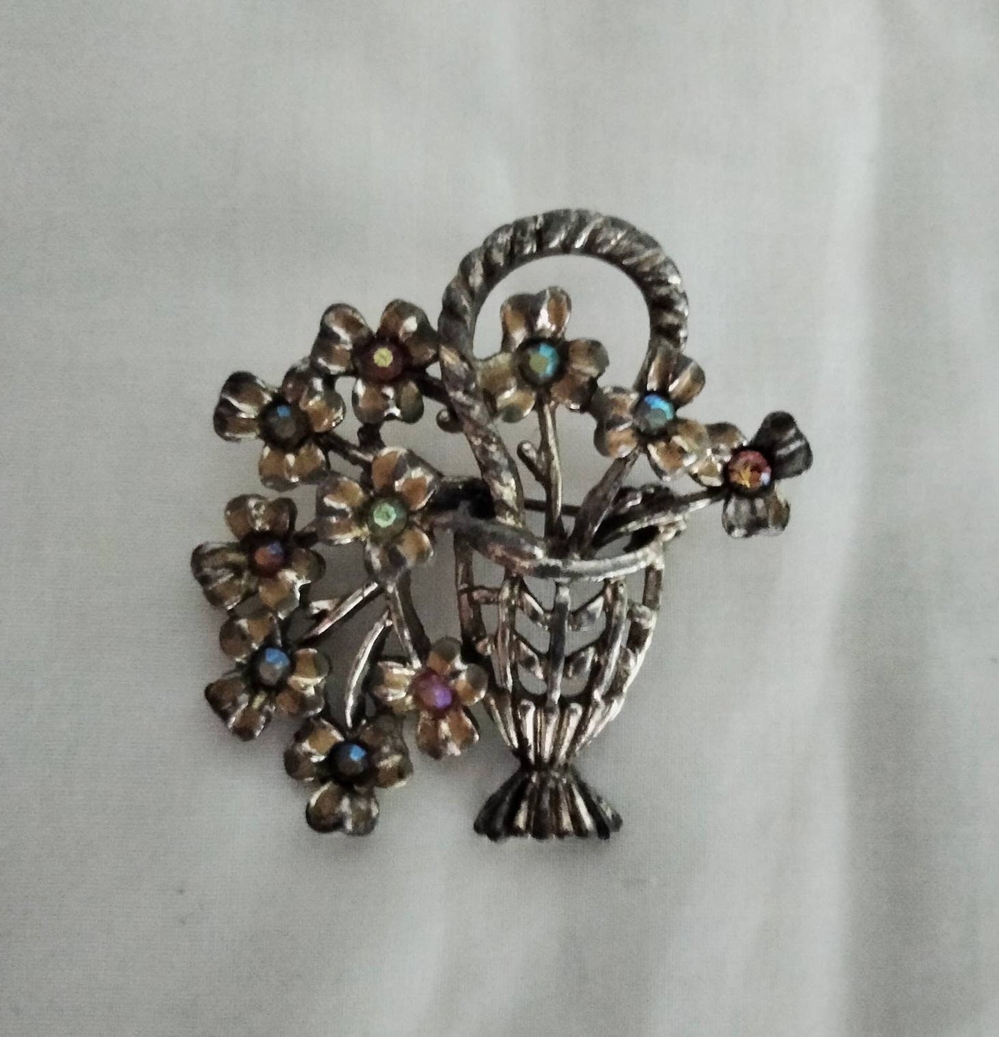 1950s goldtone enamel & aurora borealis rhinestone flower basket brooch