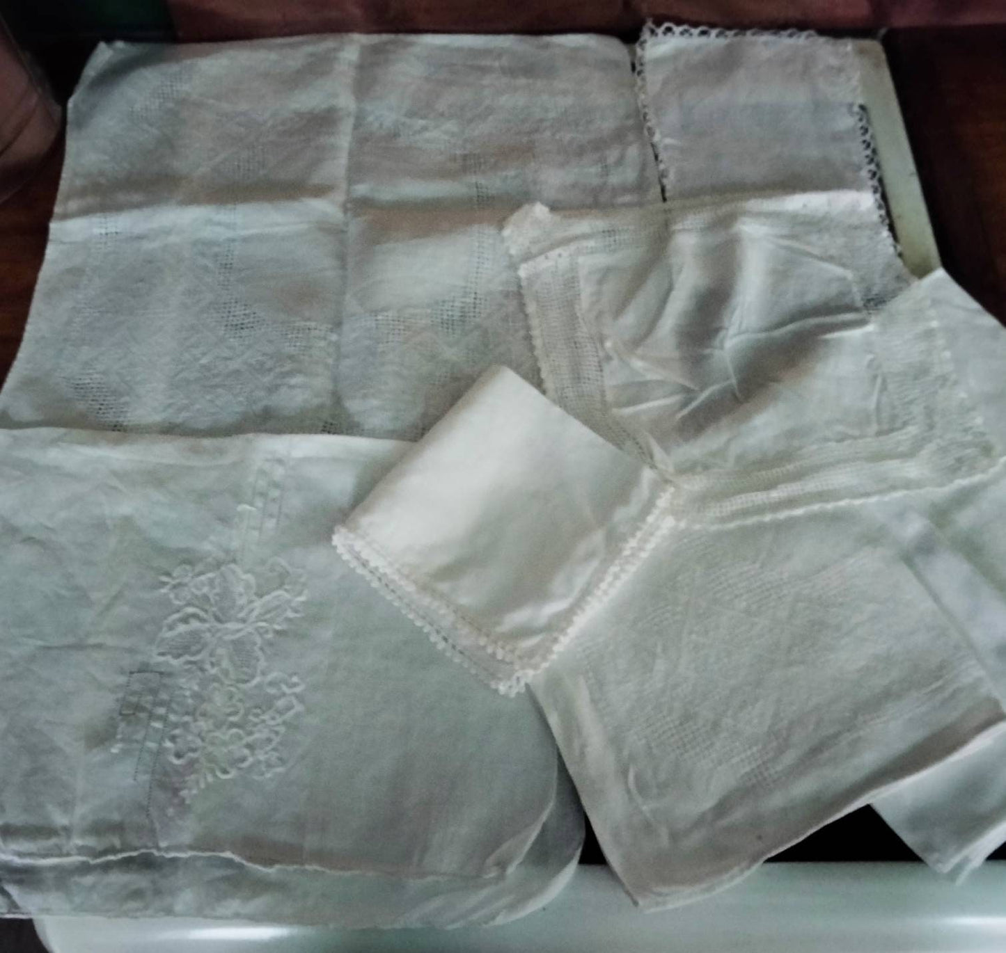 Lot of 7 Edwardian white jacquard doilies, cloths & mats