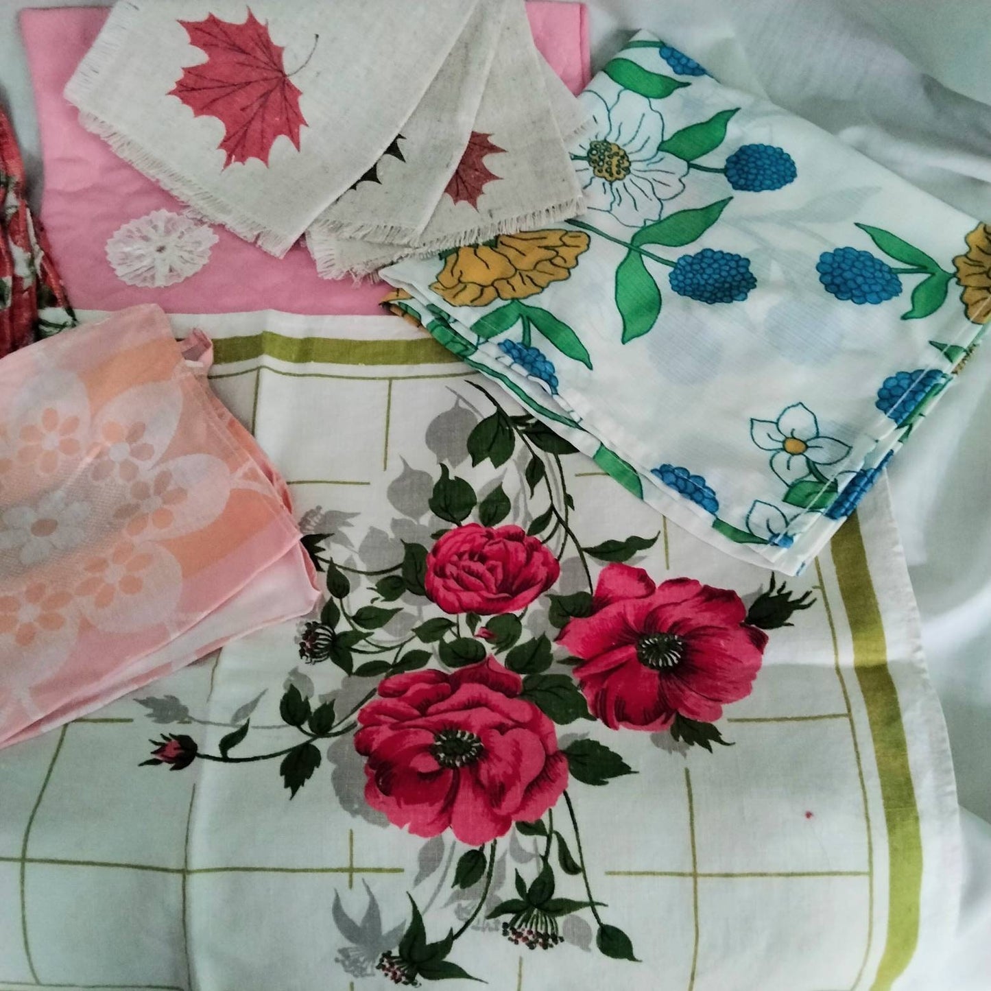 Lot of 9 mid century floral tray cloths, mats & doilies red pink