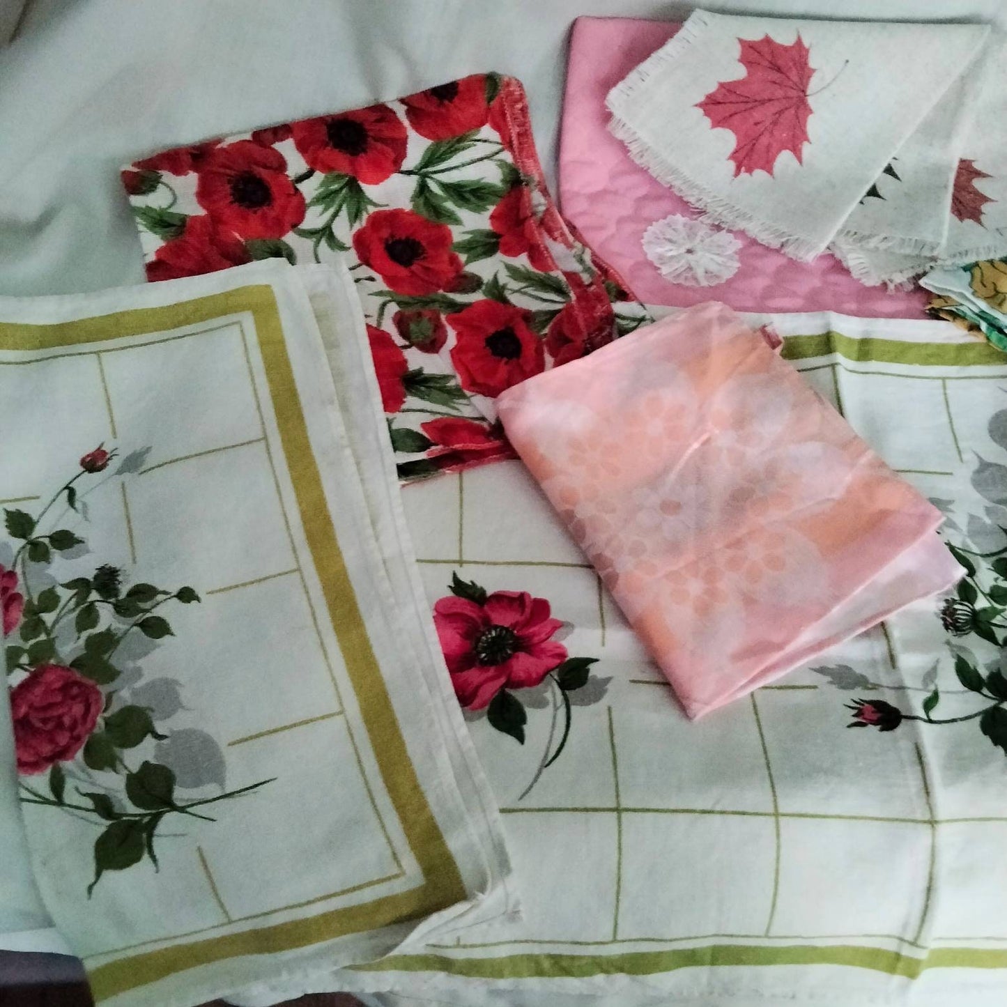 Lot of 9 mid century floral tray cloths, mats & doilies red pink