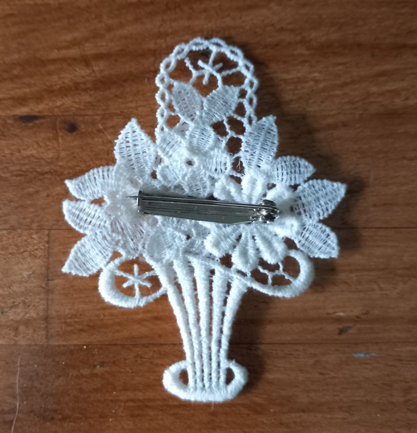 Late 20th century embroidered lace white flower basket brooch