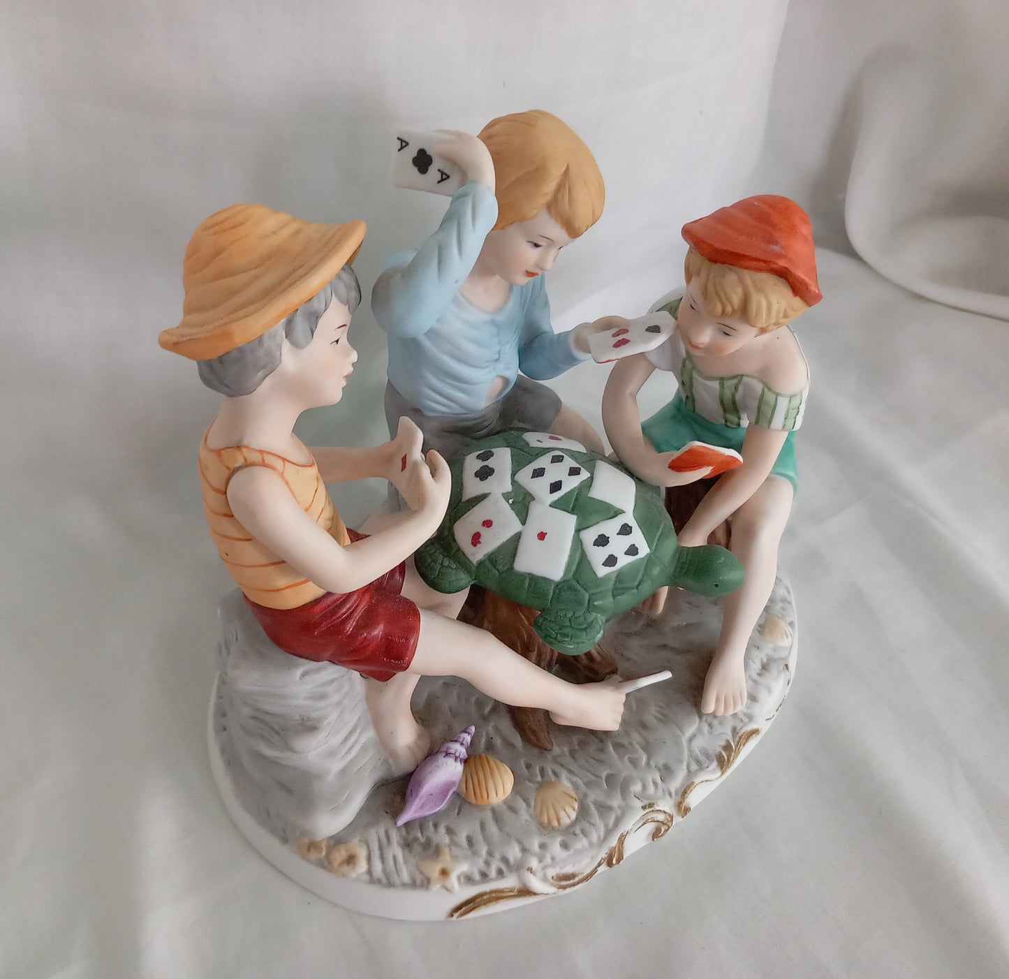 Vintage kitsch ceramic figurine statue Of 3 Boys Playing Cards On A Turtle