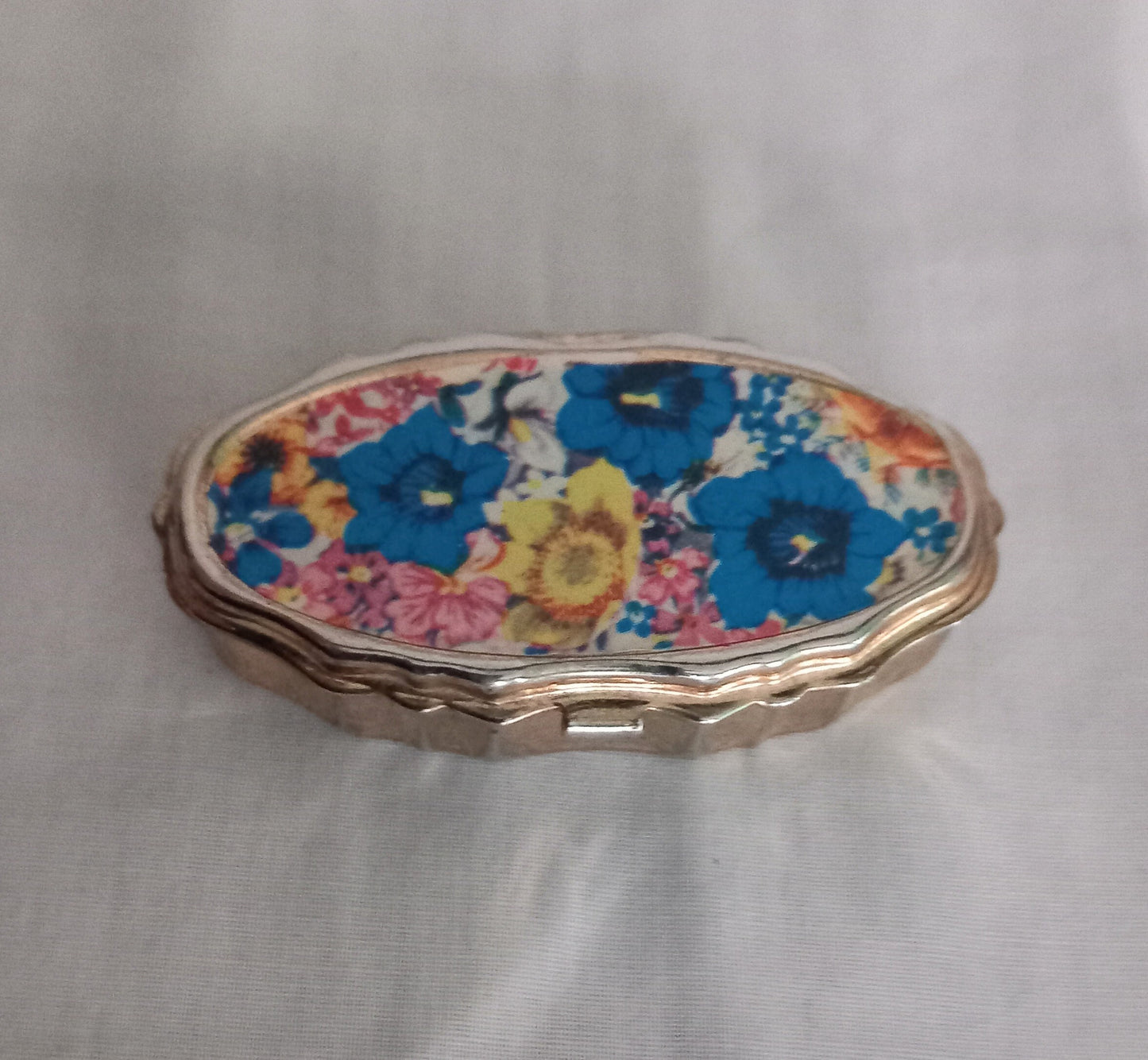 Mid Century Goldtone Pill Pot Sewing Kit With Pink, Blue & Yellow Flower Design