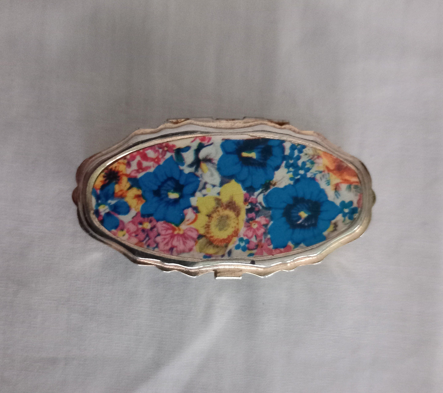 Mid Century Goldtone Pill Pot Sewing Kit With Pink, Blue & Yellow Flower Design