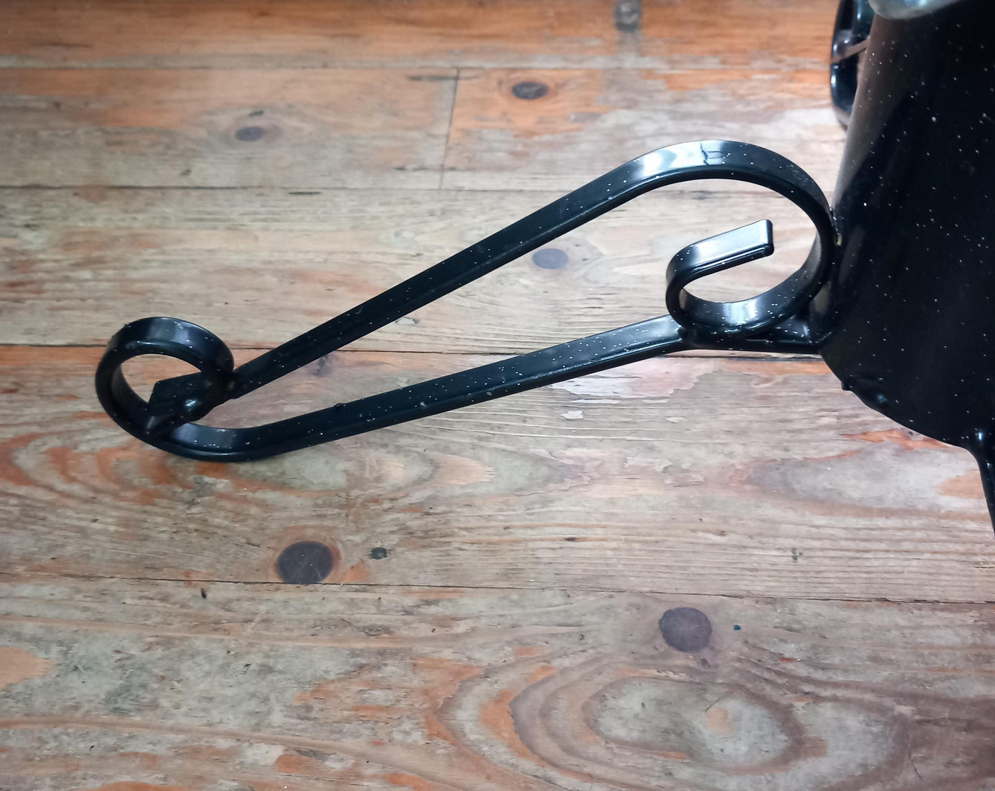 Black curled wrought iron Christmas tree stand