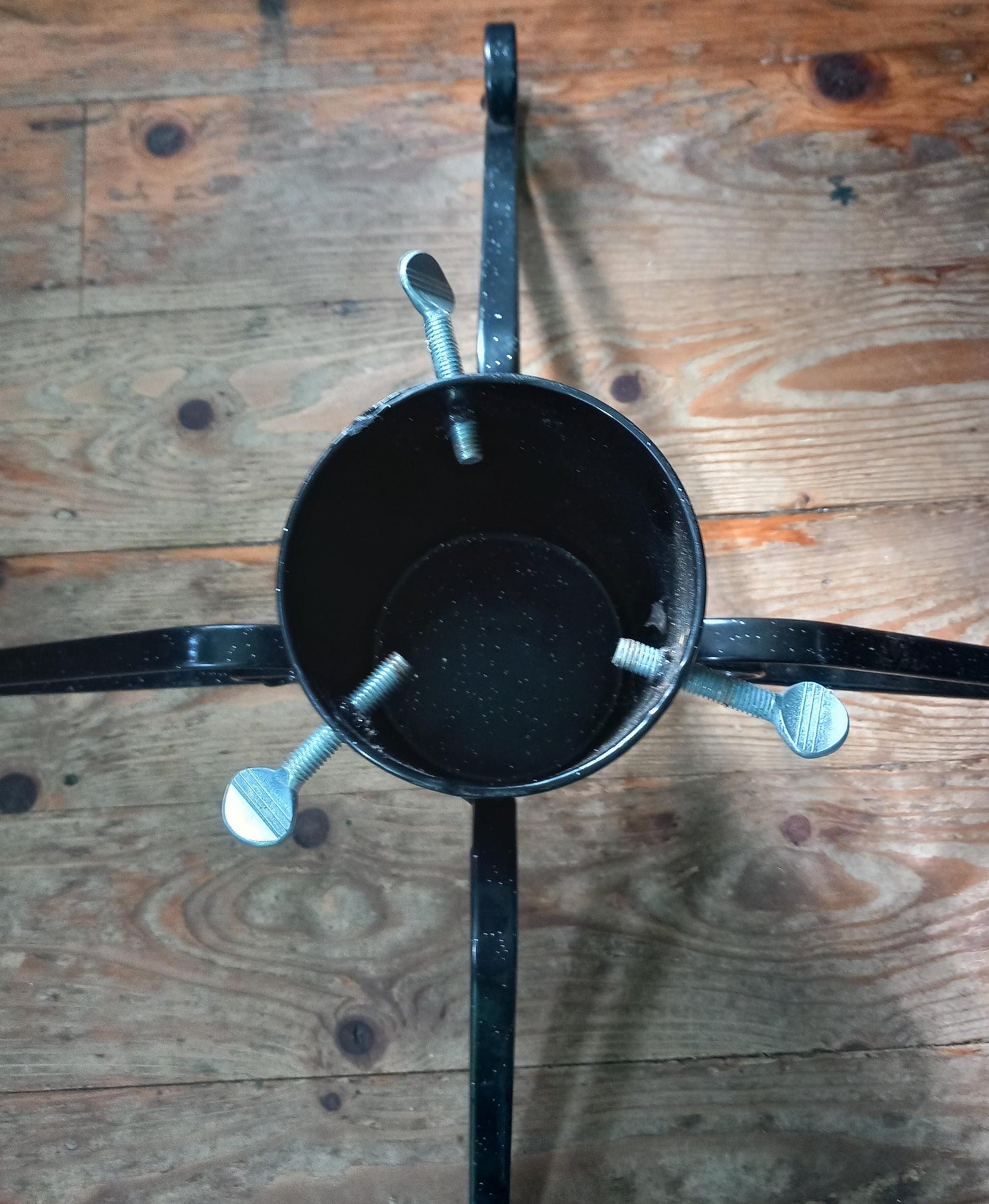 Black curled wrought iron Christmas tree stand