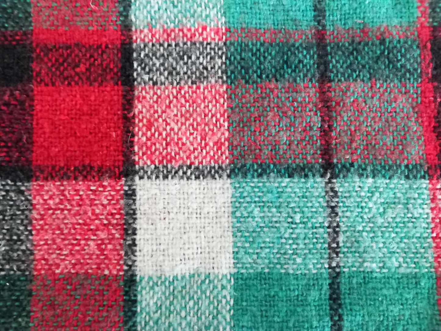 Vintage fringed baby blanket in red and green tartan pattern