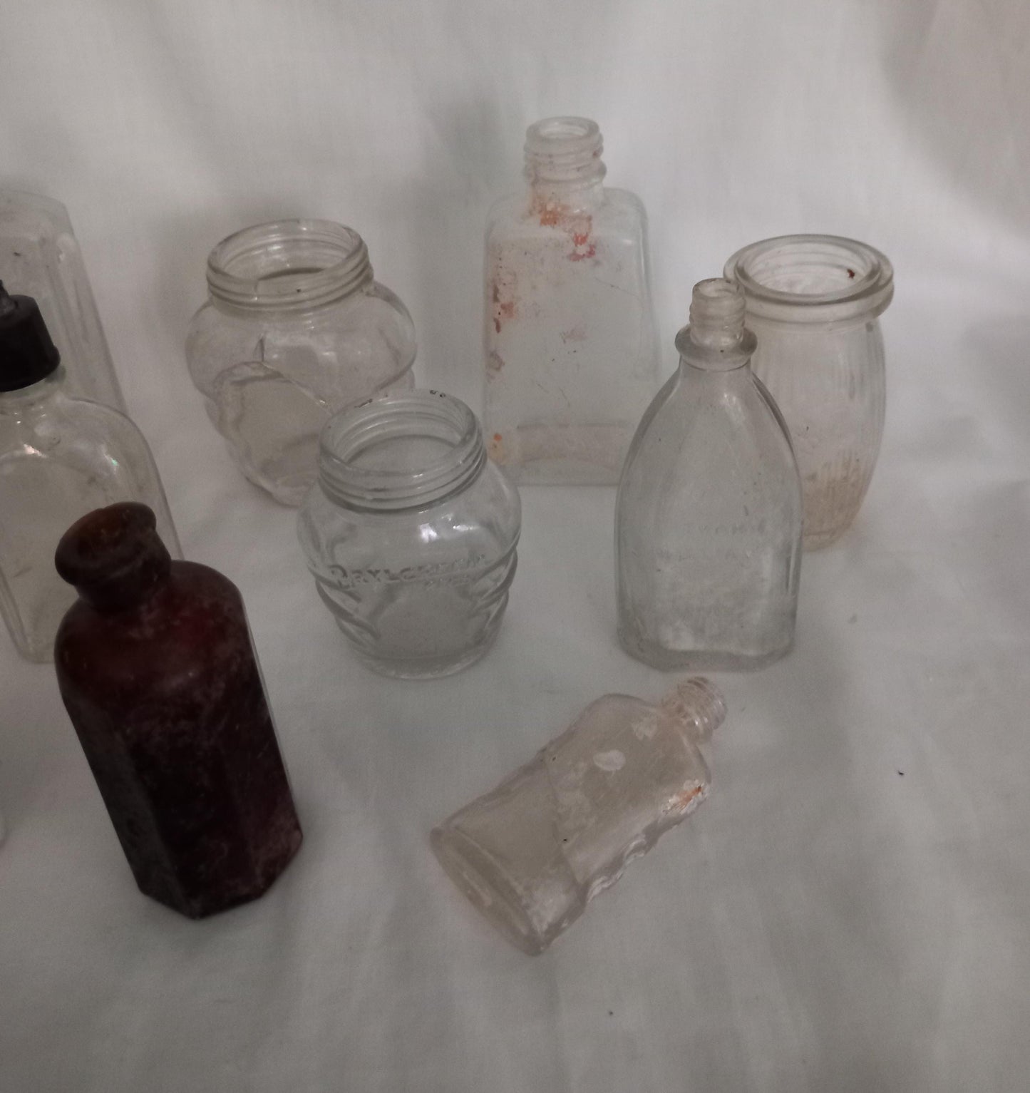 Collection of 11 early 20th century art deco glass bottles