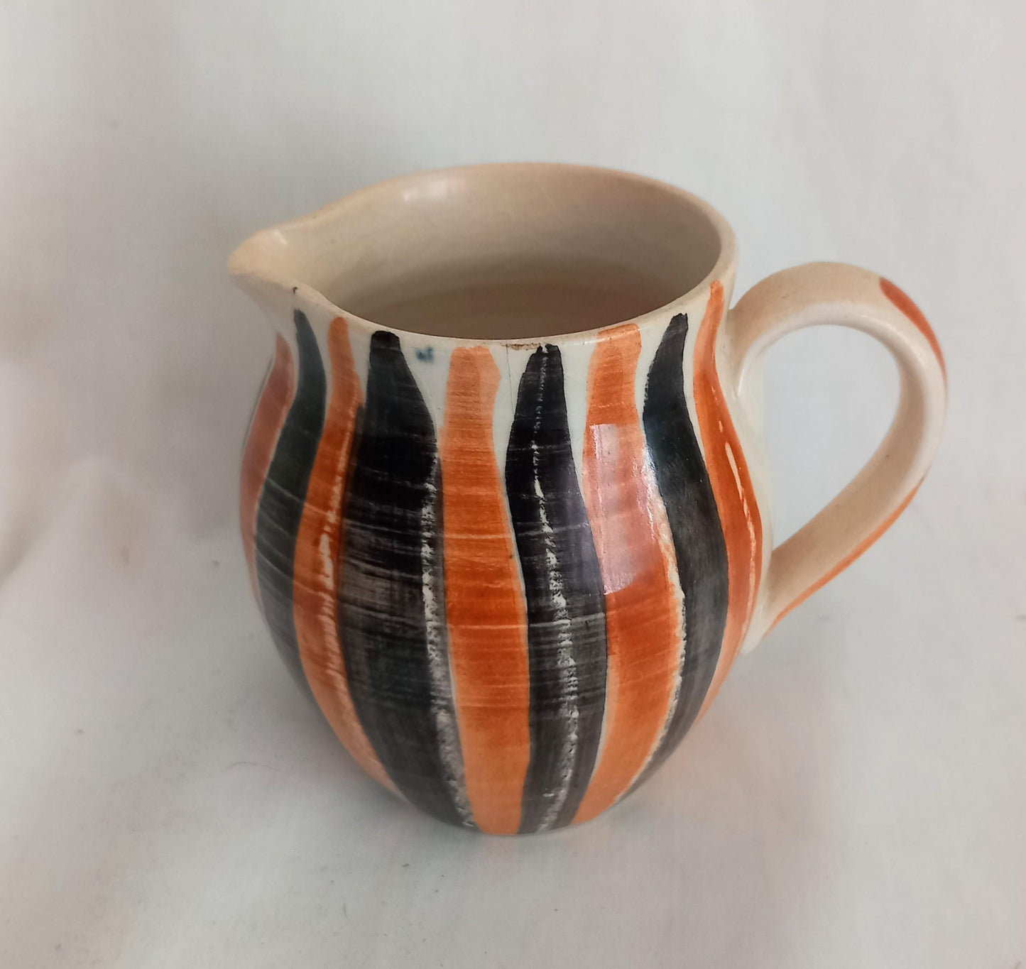 Mid Century studio pottery jug with orange and black striped glaze