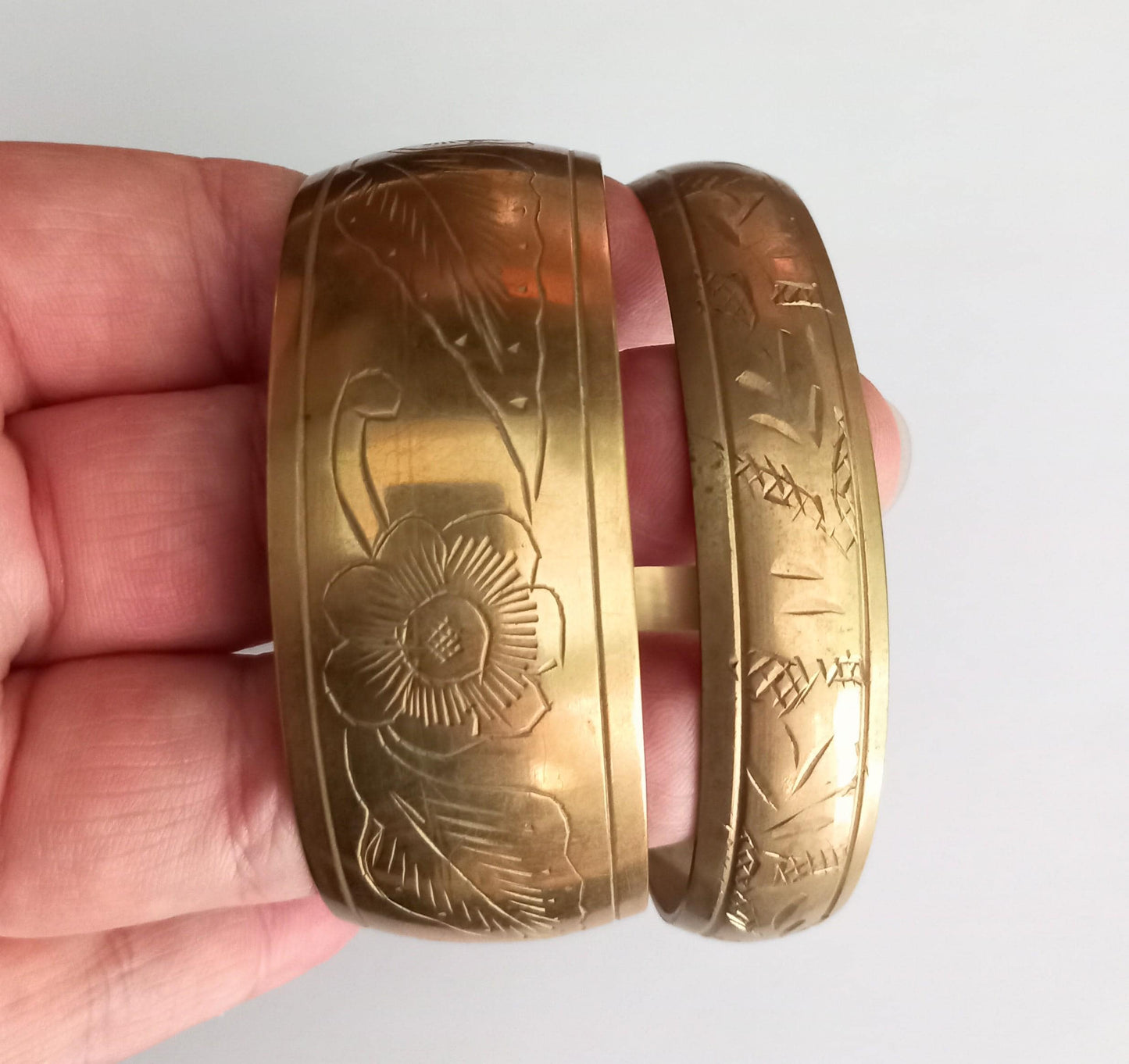 Pair of 1980s Indian goldtone brass floral design bangle bracelets