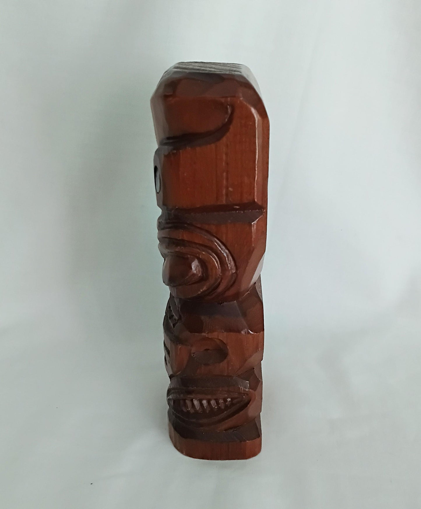 Hand carved wooden Tiki style statue set with abalone shell