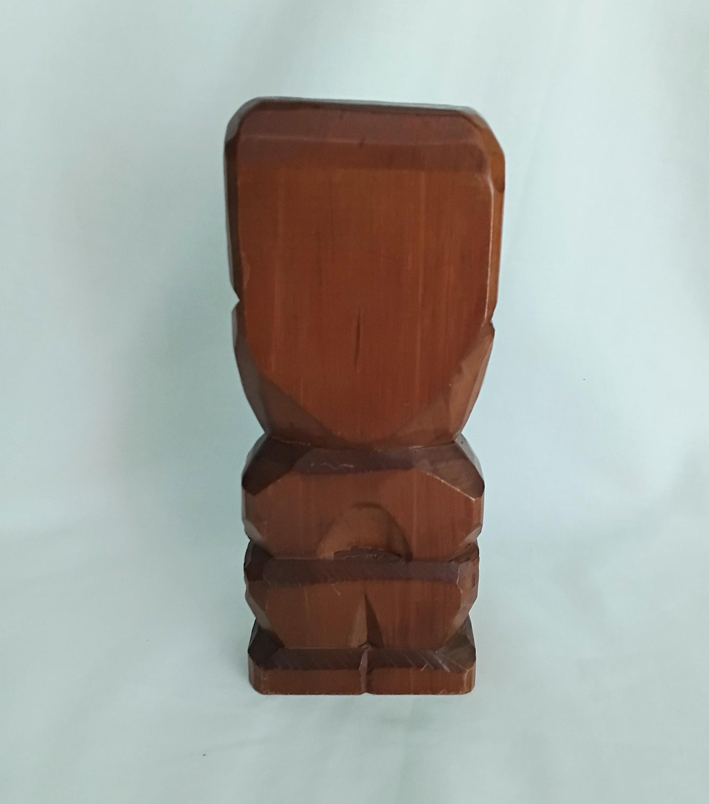 Hand carved wooden Tiki style statue set with abalone shell