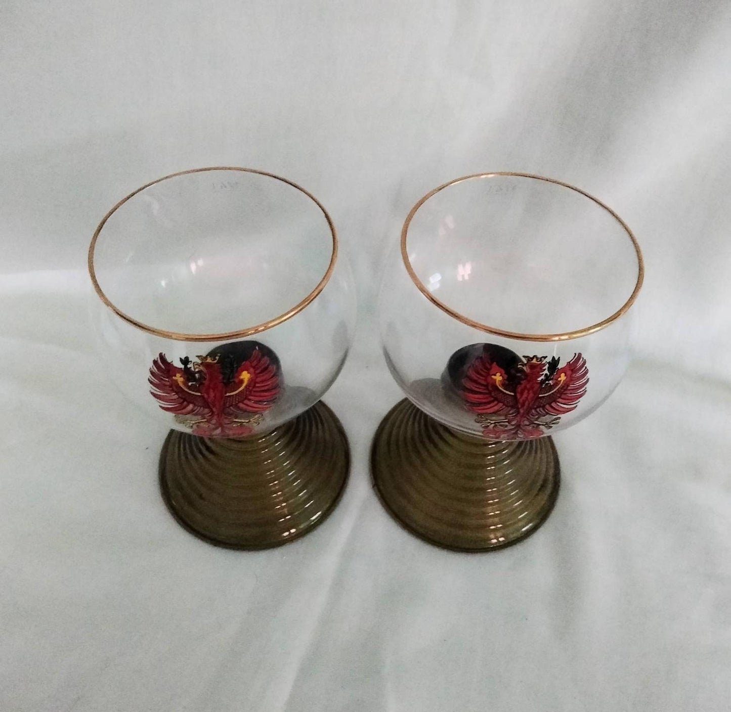 1970s pair of red phoenix design green glass beehive stem wine glasses