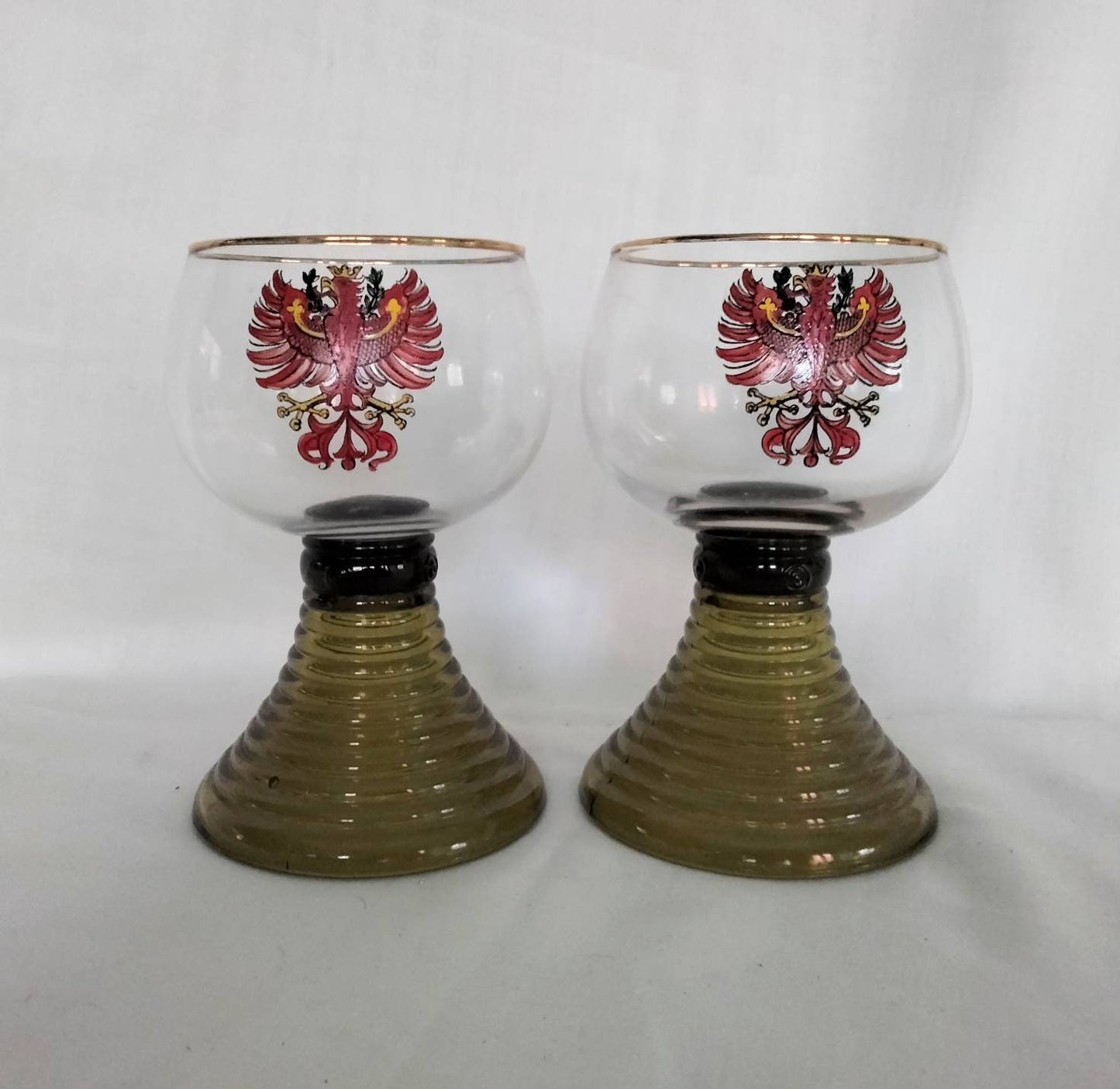 1970s pair of red phoenix design green glass beehive stem wine glasses