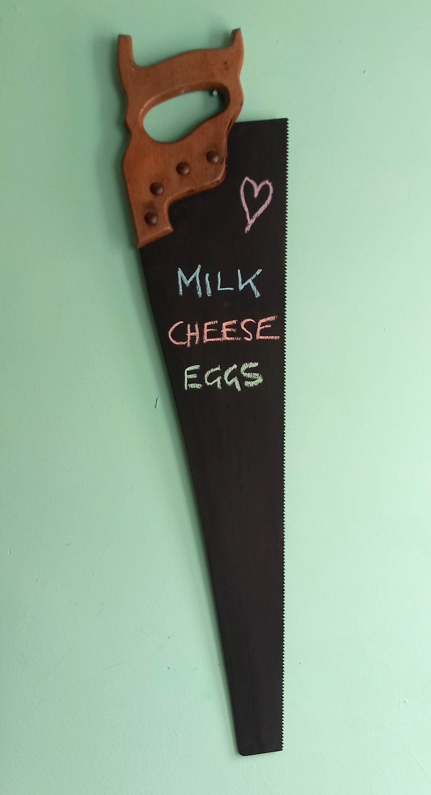 Vintage wooden handled saw wall mounted chalkboard