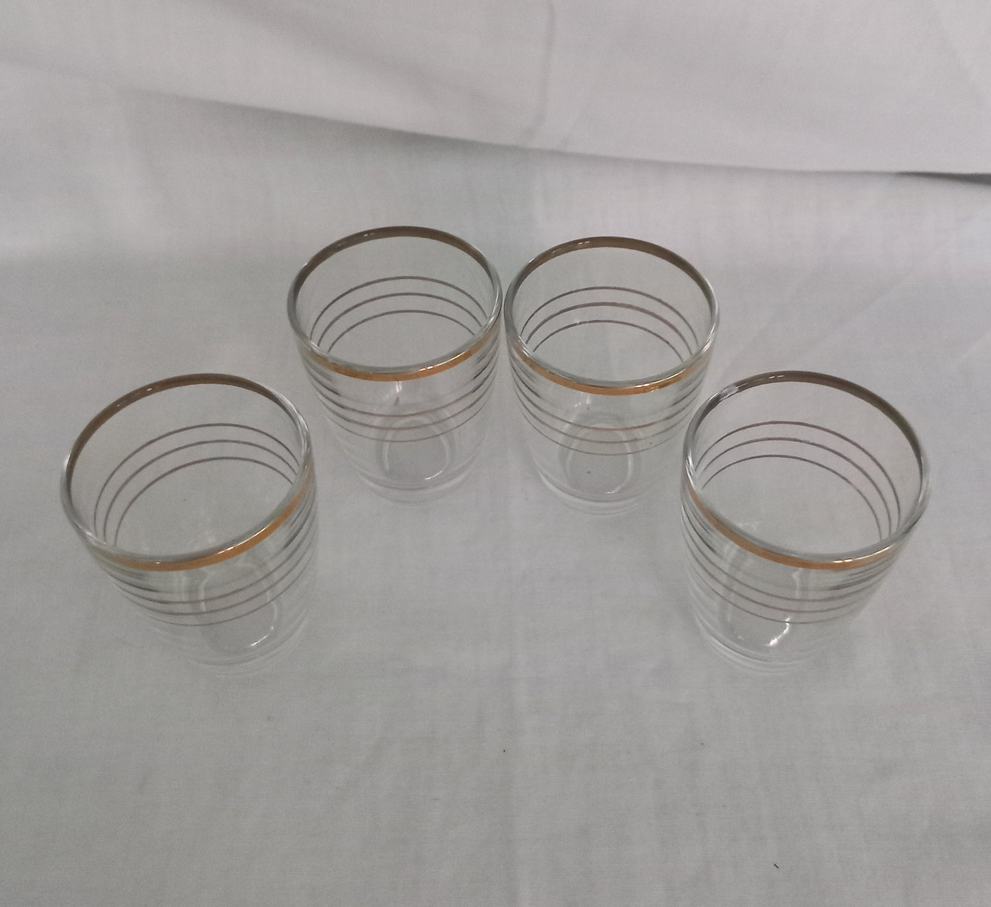 Set of 4 1950s gold striped banded design shot glasses