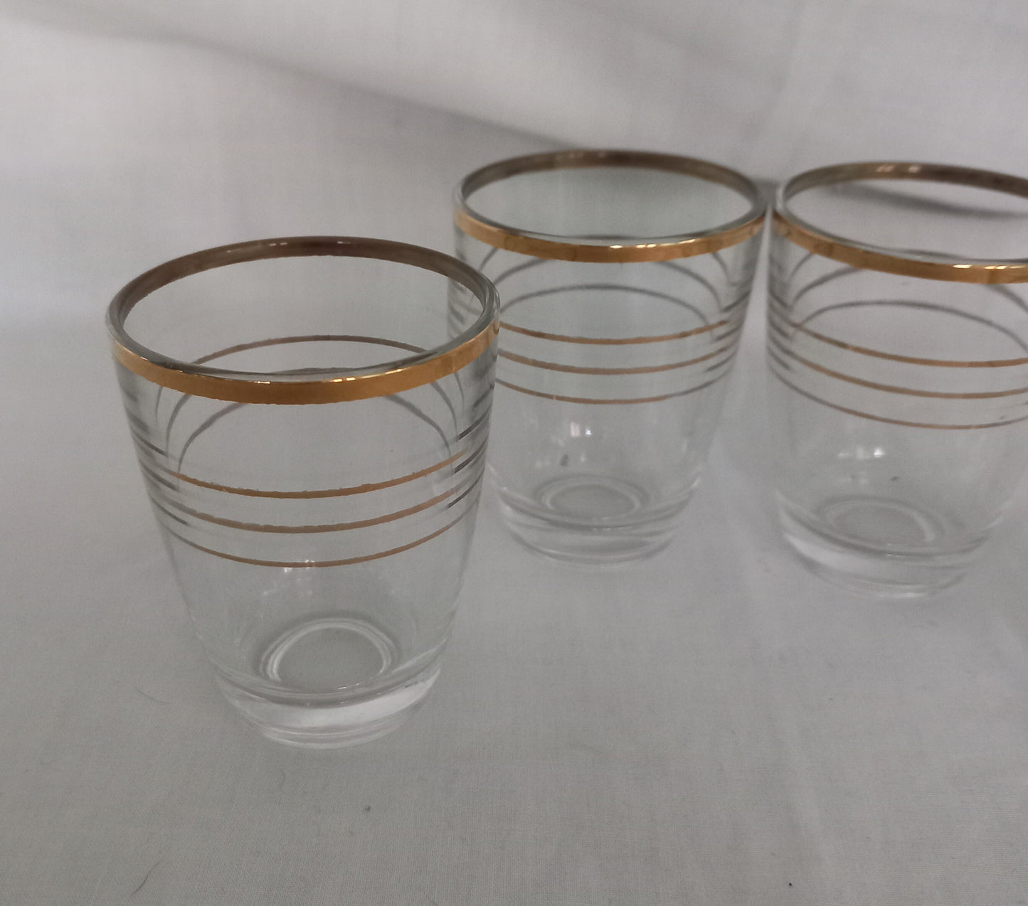 Set of 4 1950s gold striped banded design shot glasses