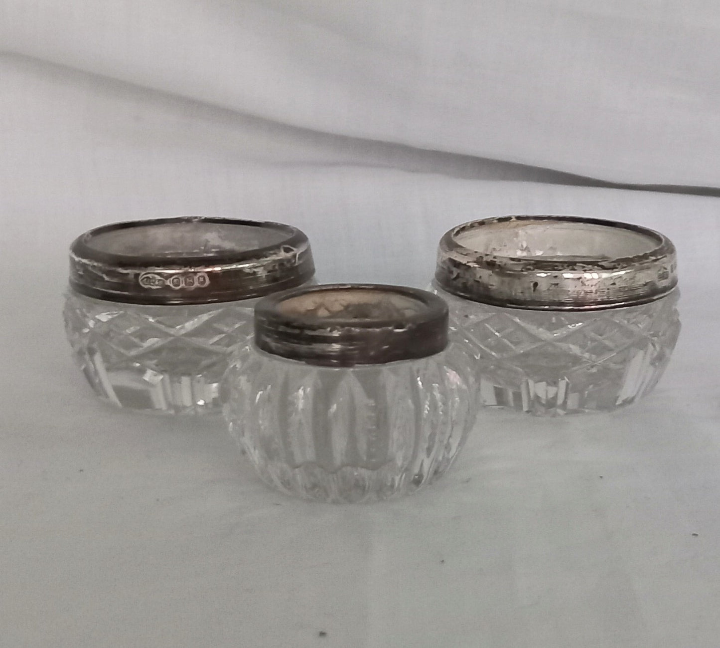 Pair Of Antique Hallmarked Silver Rimmed Clear Cut Glass Salt Cellars London 1921 & another single salt