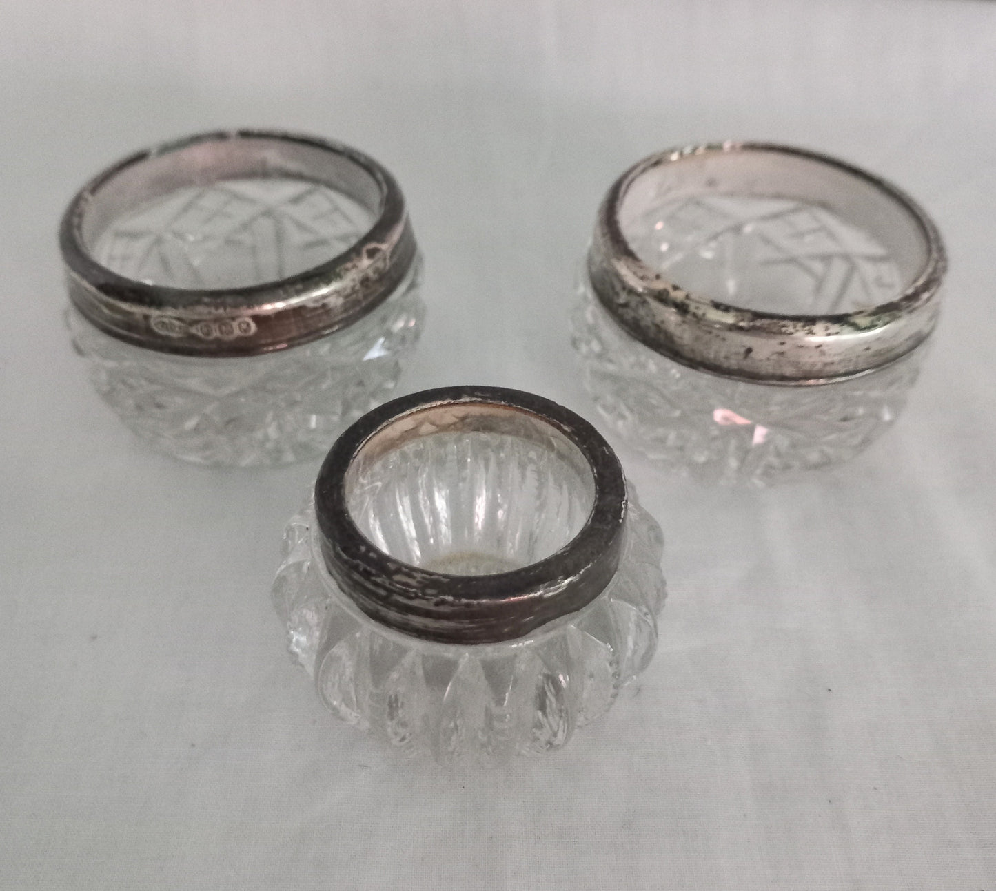 Pair Of Antique Hallmarked Silver Rimmed Clear Cut Glass Salt Cellars London 1921 & another single salt