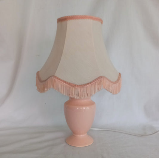 1980s peach orange table lamp with matching fringed shade