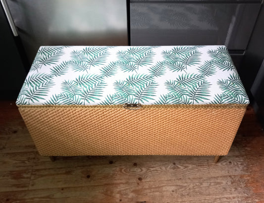 1970s wicker storage ottoman reupholstered with green palm fabric