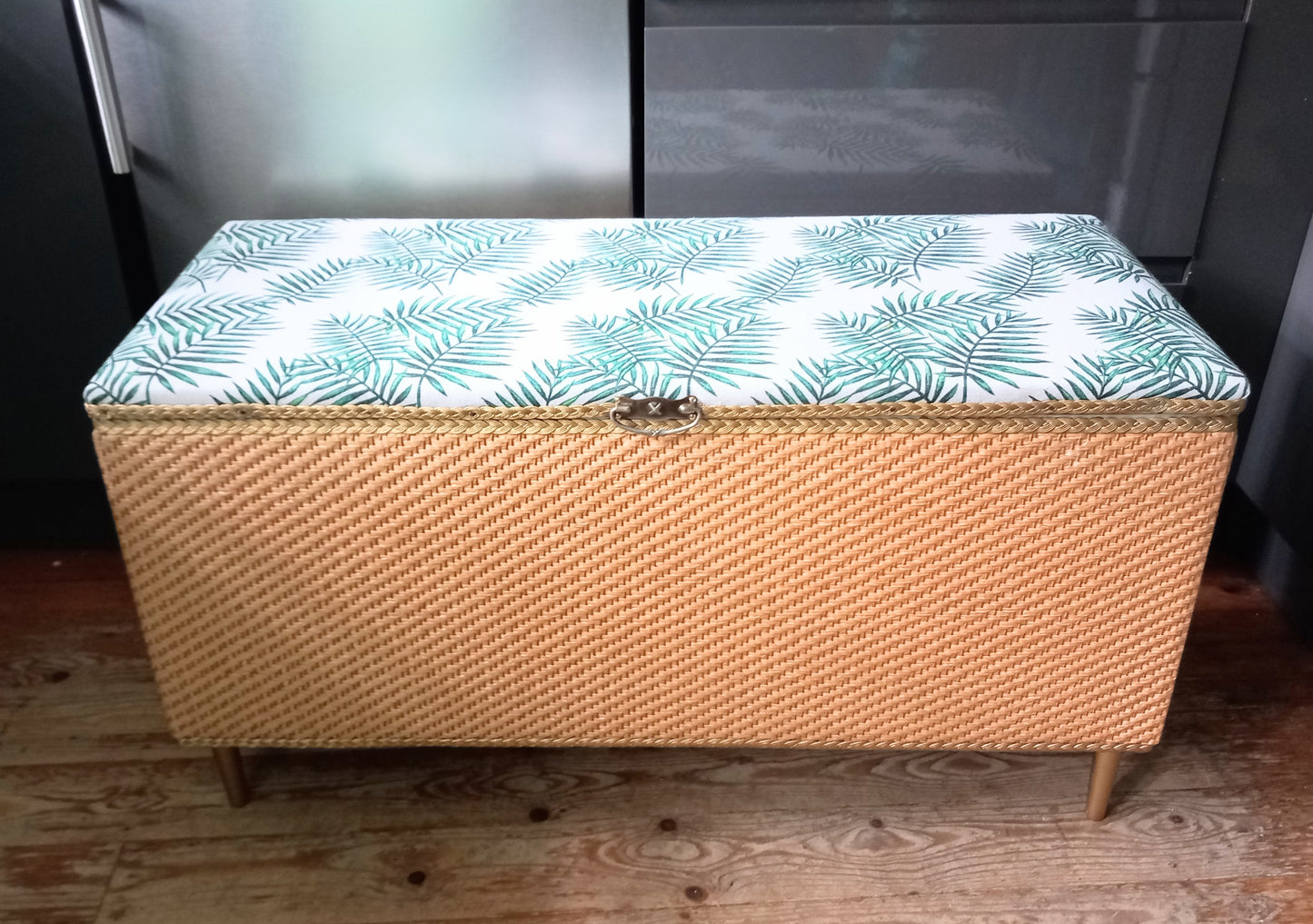 1970s wicker storage ottoman reupholstered with green palm fabric