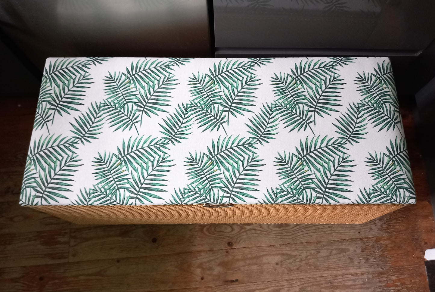 1970s wicker storage ottoman reupholstered with green palm fabric