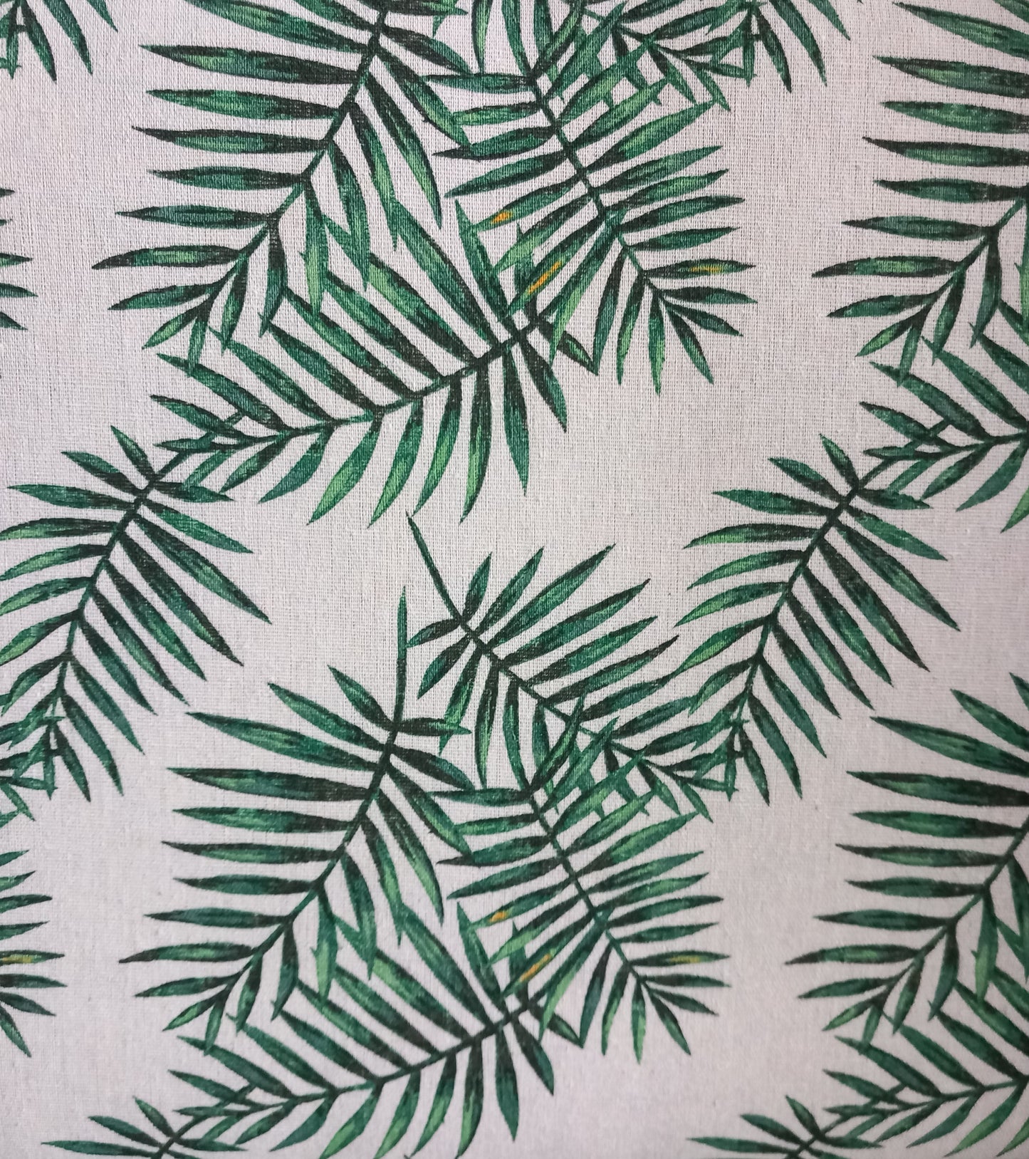 1970s wicker storage ottoman reupholstered with green palm fabric