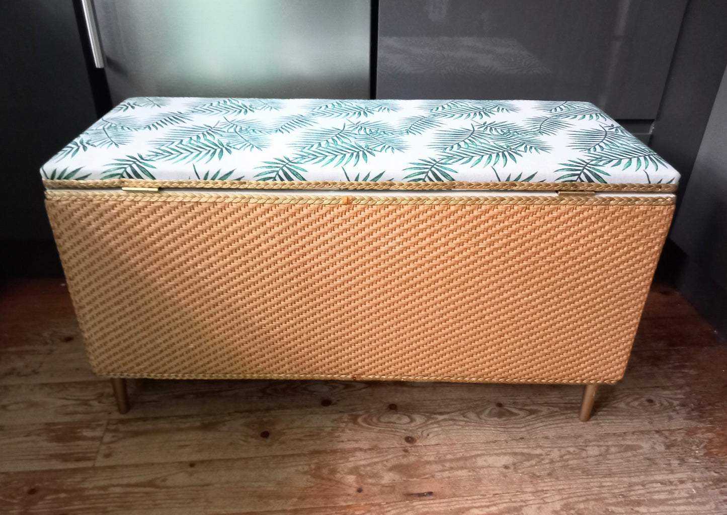 1970s wicker storage ottoman reupholstered with green palm fabric