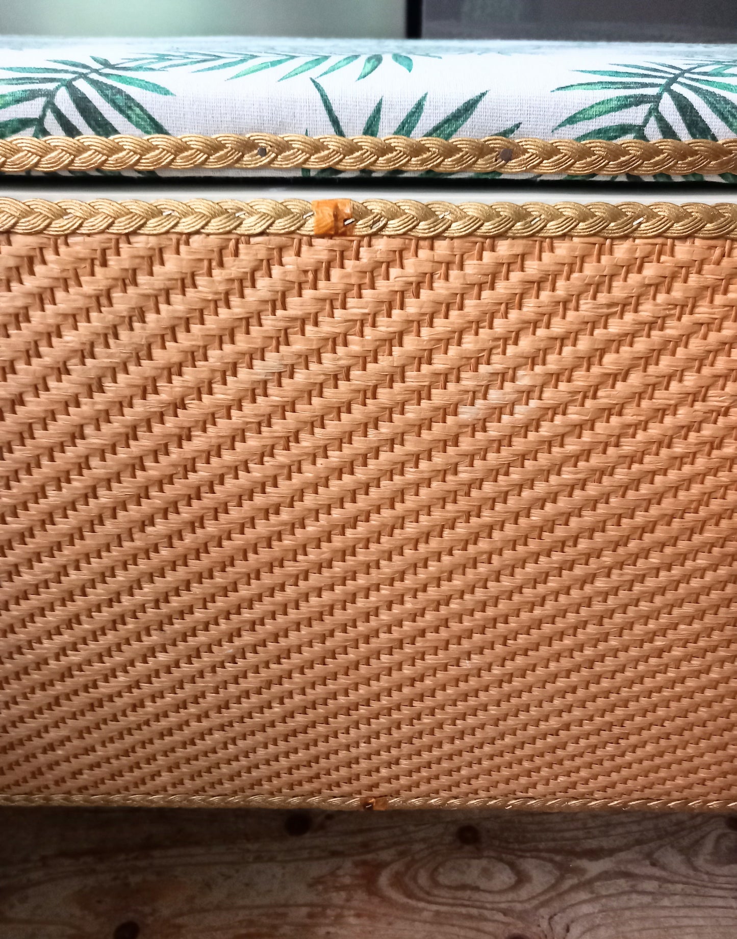 1970s wicker storage ottoman reupholstered with green palm fabric