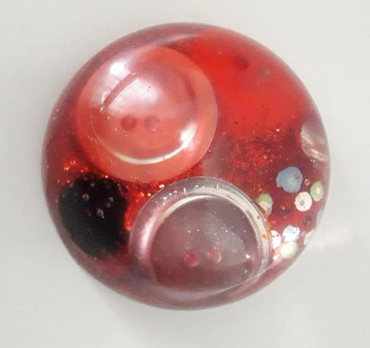Handmade resin paperweight inlaid with red vintage buttons and glitter
