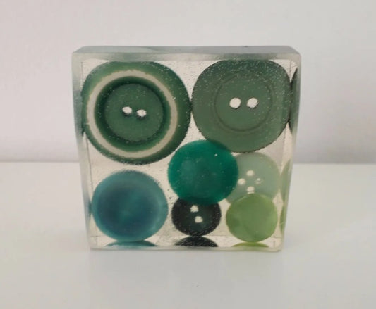 Handmade resin paperweight inlaid with green vintage buttons