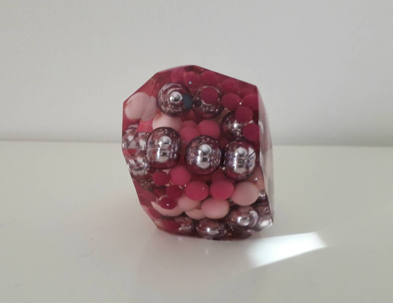 Hand made epoxy resin gem shaped paperweight inlaid with vintage pink beads